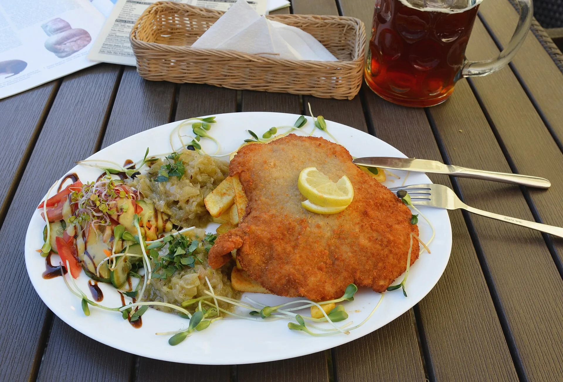 Golden Wiener Schnitzel served with a side salad.