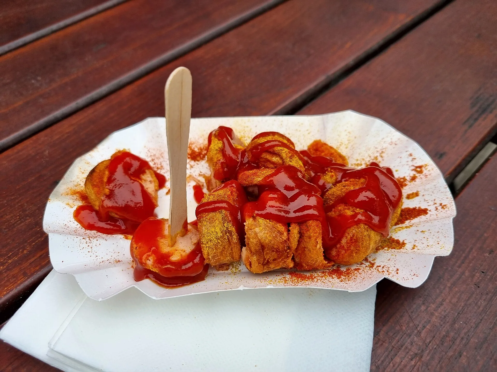 Currywurst served with sauce in Berlin.