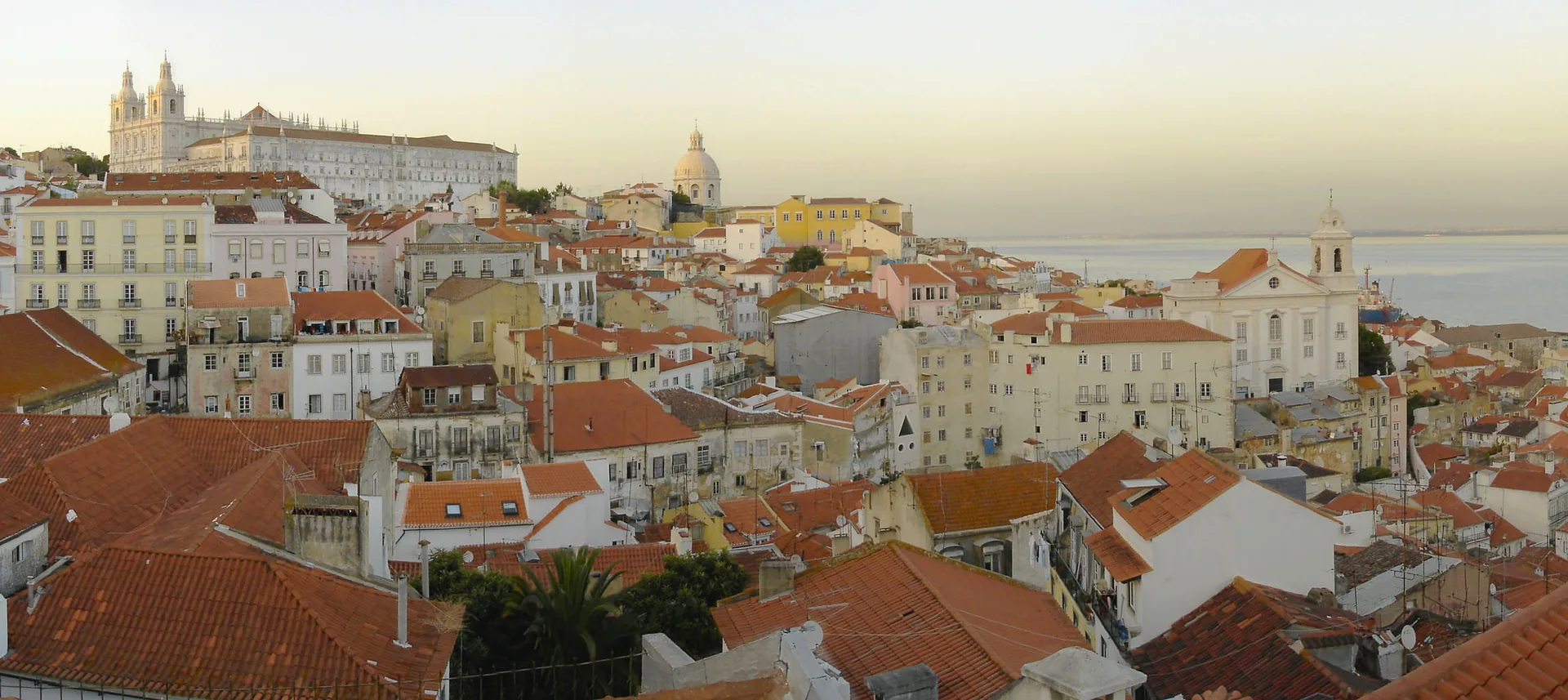 Red-roofed buildings across Alfama, viewed from the Miradouro de Santa Luzia.