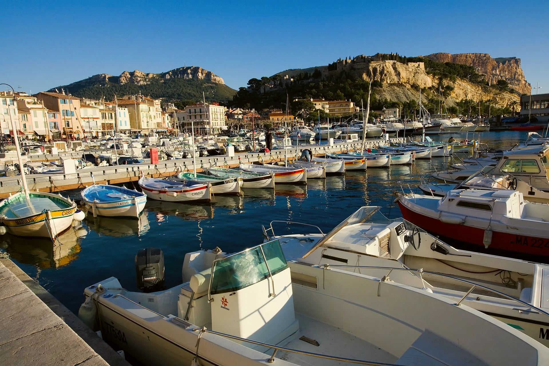 The harbour at Cassis, with boats moored beneath the surrounding hills.