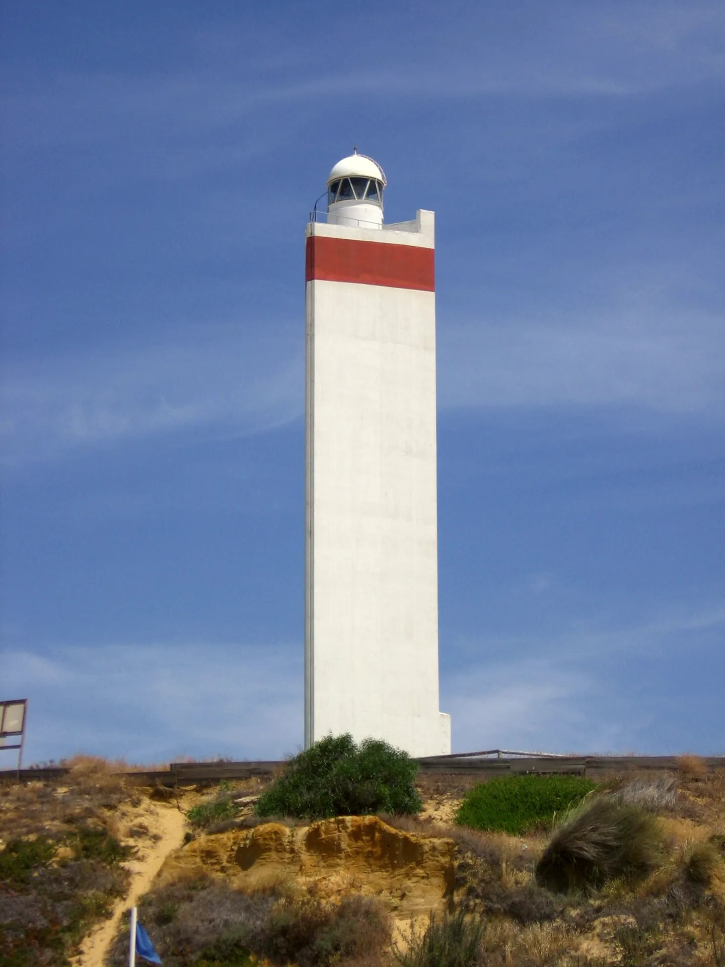 Matalascañas beach with the Faro de Matalascañas at the water’s edge.