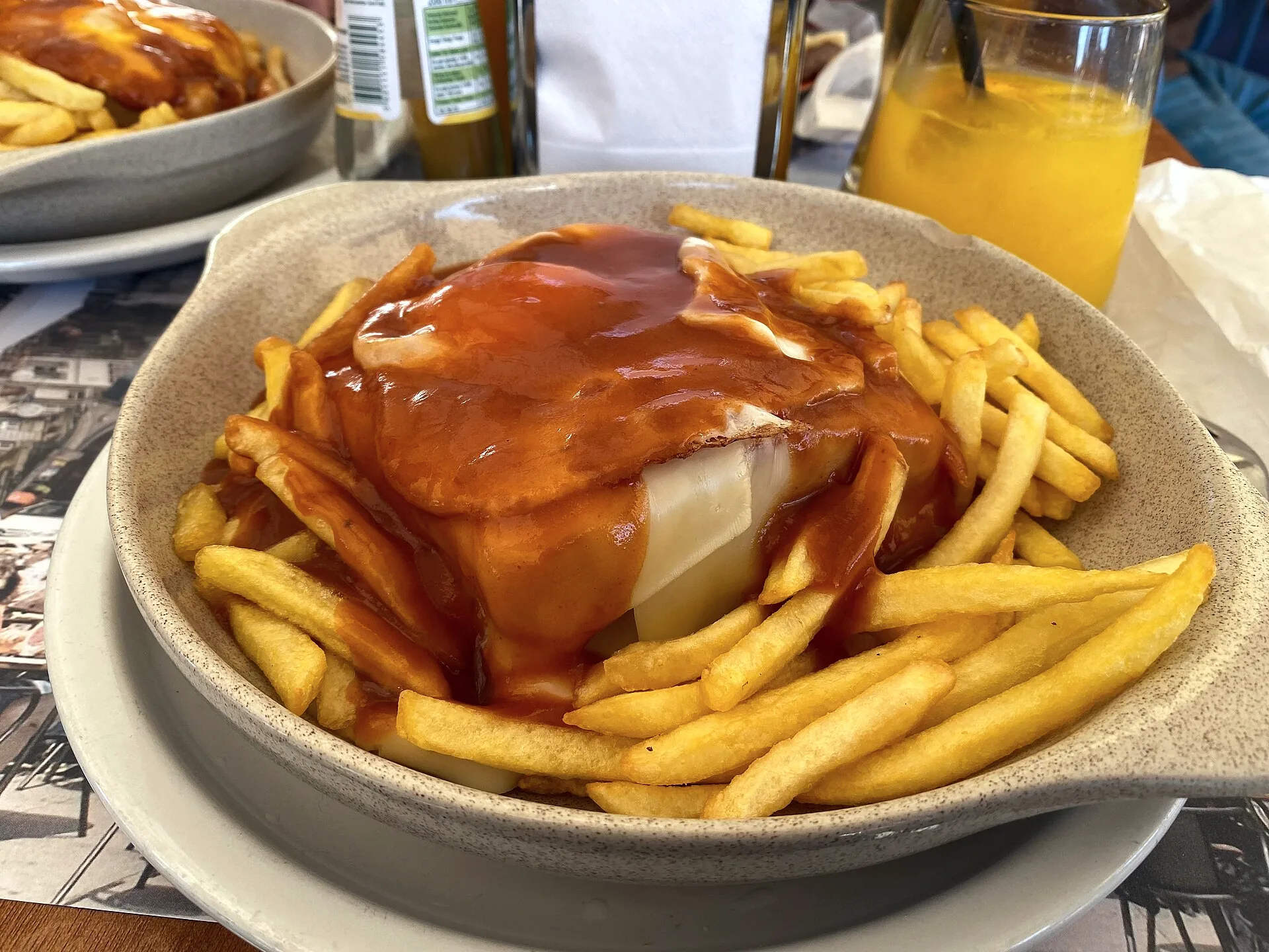 A Francesinha sandwich served at a café beside Cais da Ribeira in Porto.