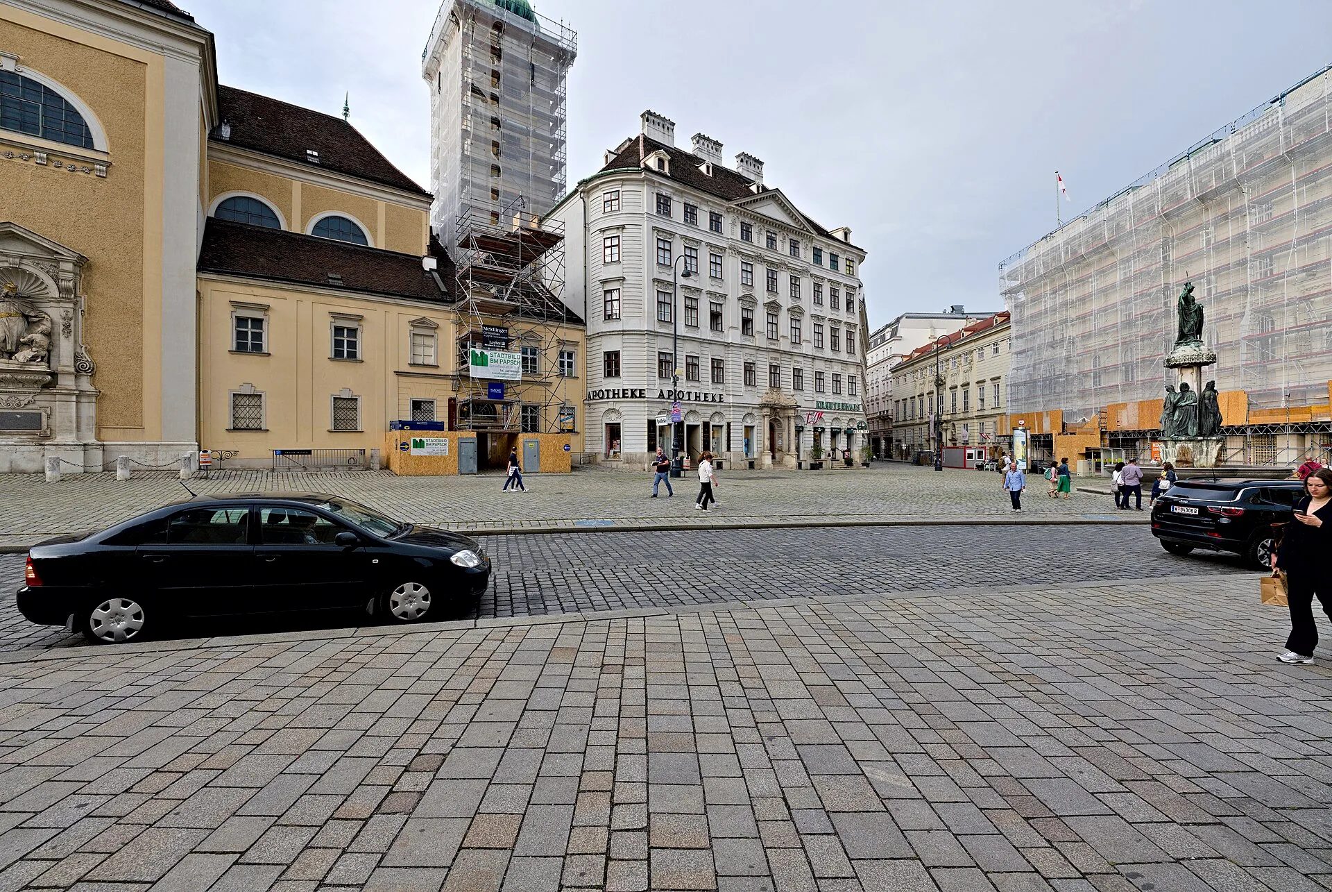 Freyung street in Vienna, with historic buildings lining the square.