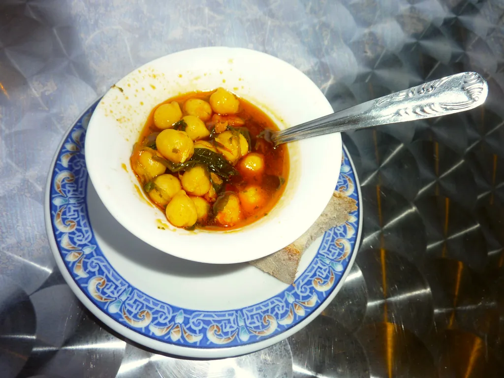 A tapa of chickpeas with spinach.