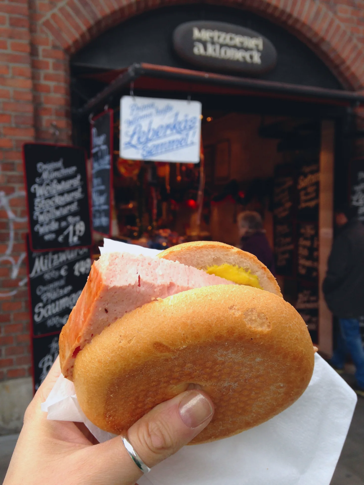 A Leberkässemmel with mustard