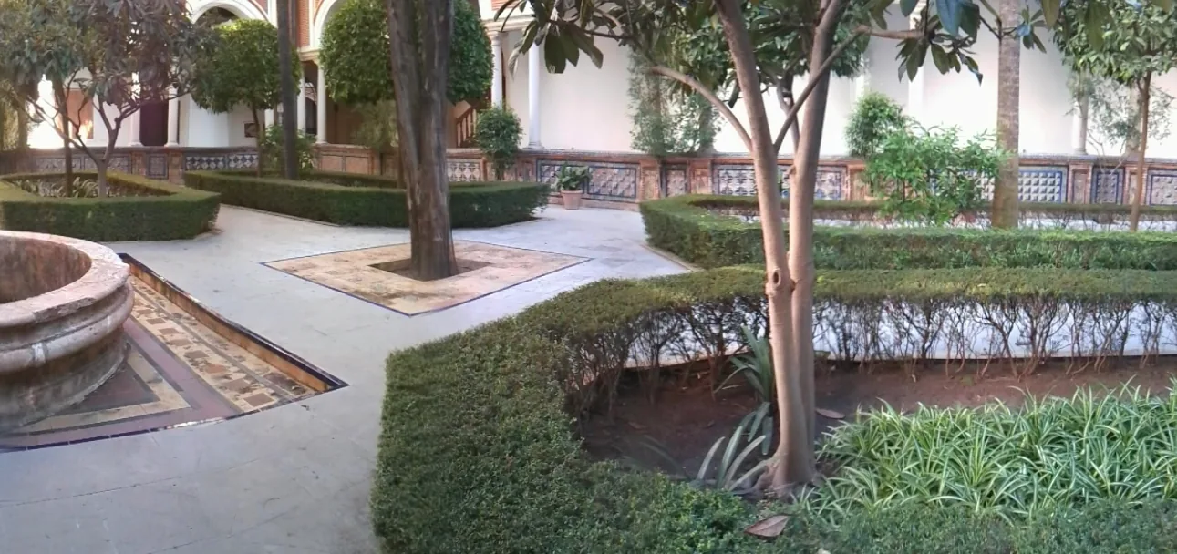 The courtyard of Seville's Museum of Fine Arts, with a columned arcade around a central open space.