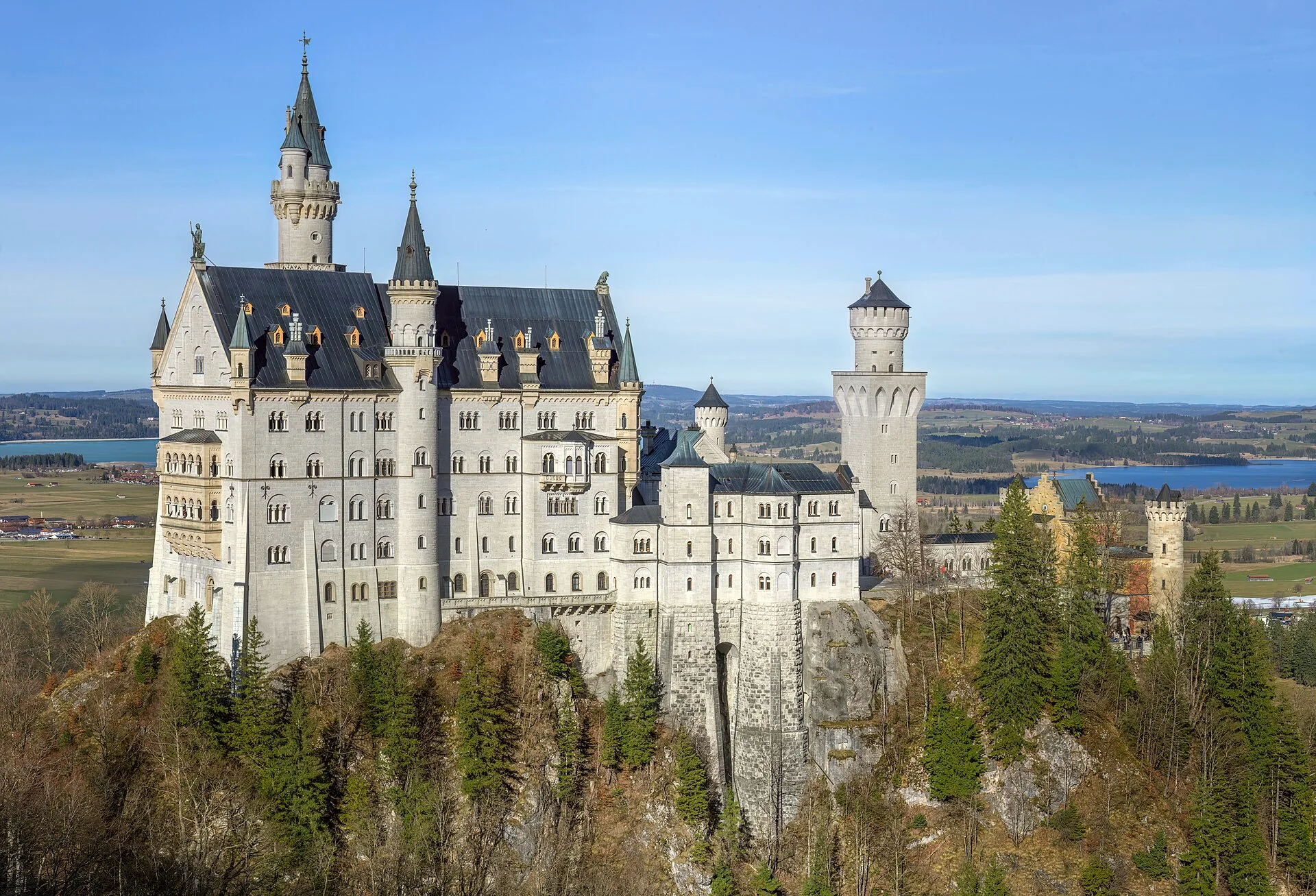 Neuschwanstein Castle above the wooded hills of Schwangau, Bavaria.