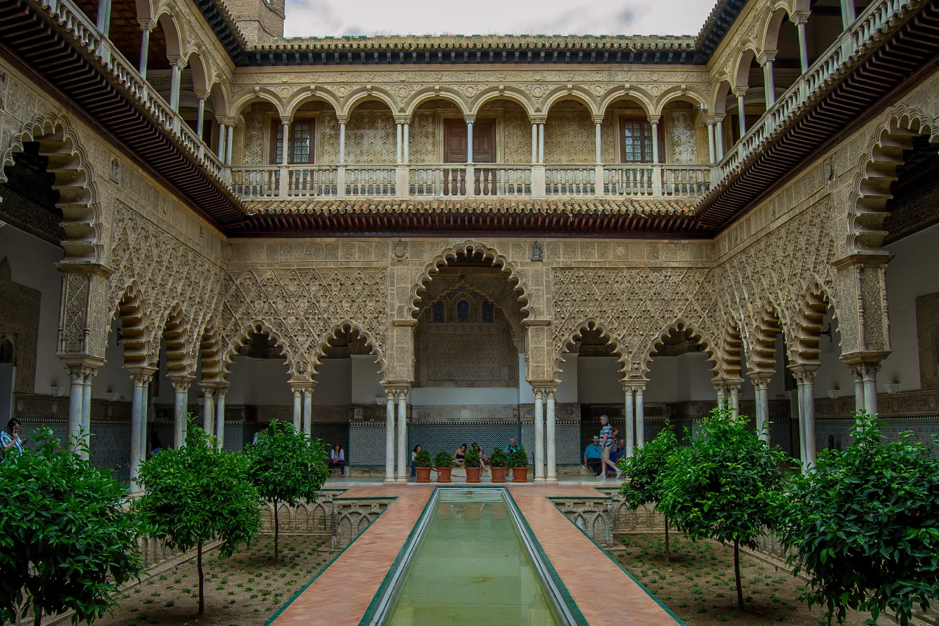 The Patio de las Doncellas at Seville’s Real Alcázar, with its central pool and two levels of arcades.