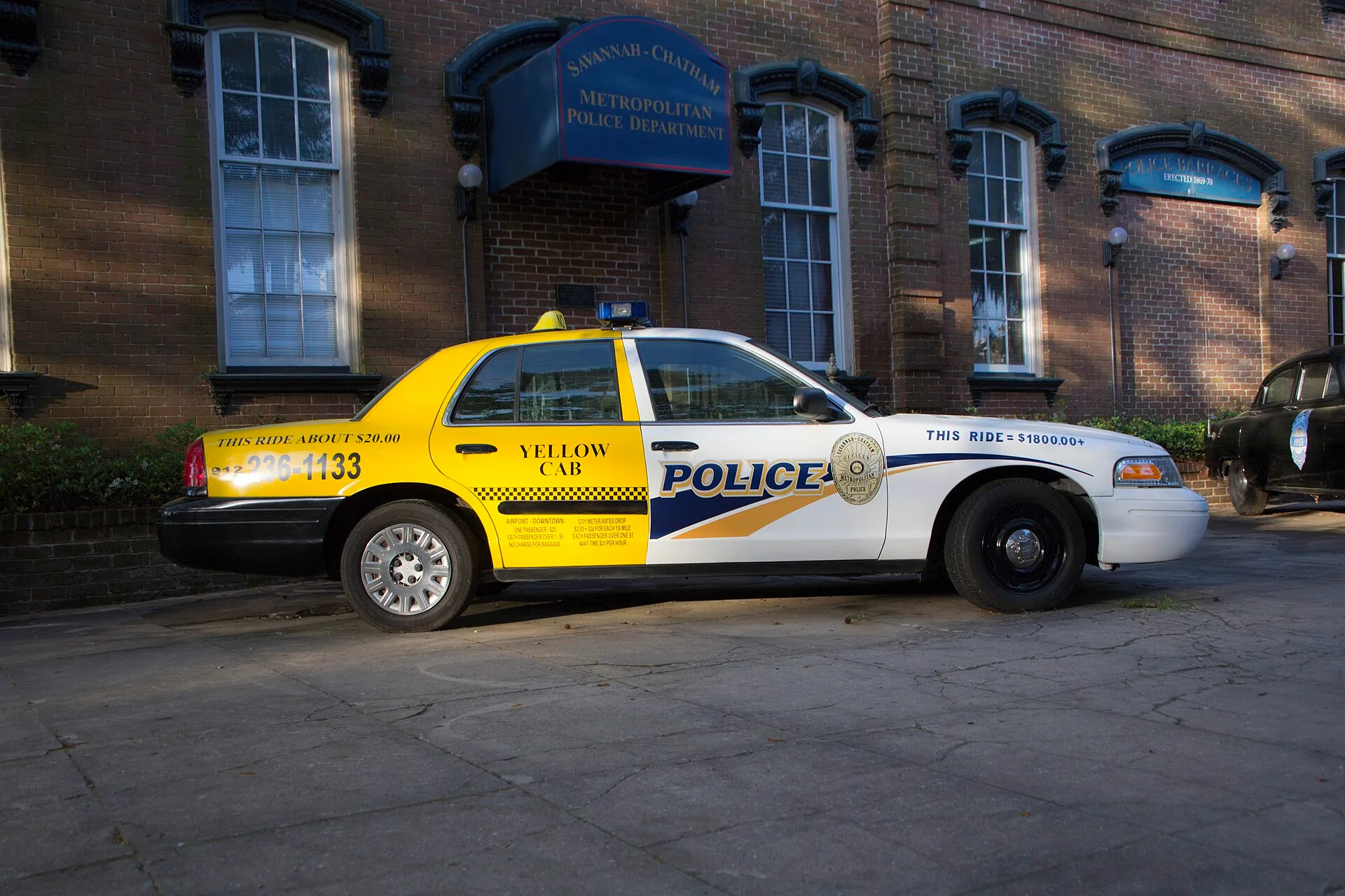 A taxi and police cruiser in Savannah.