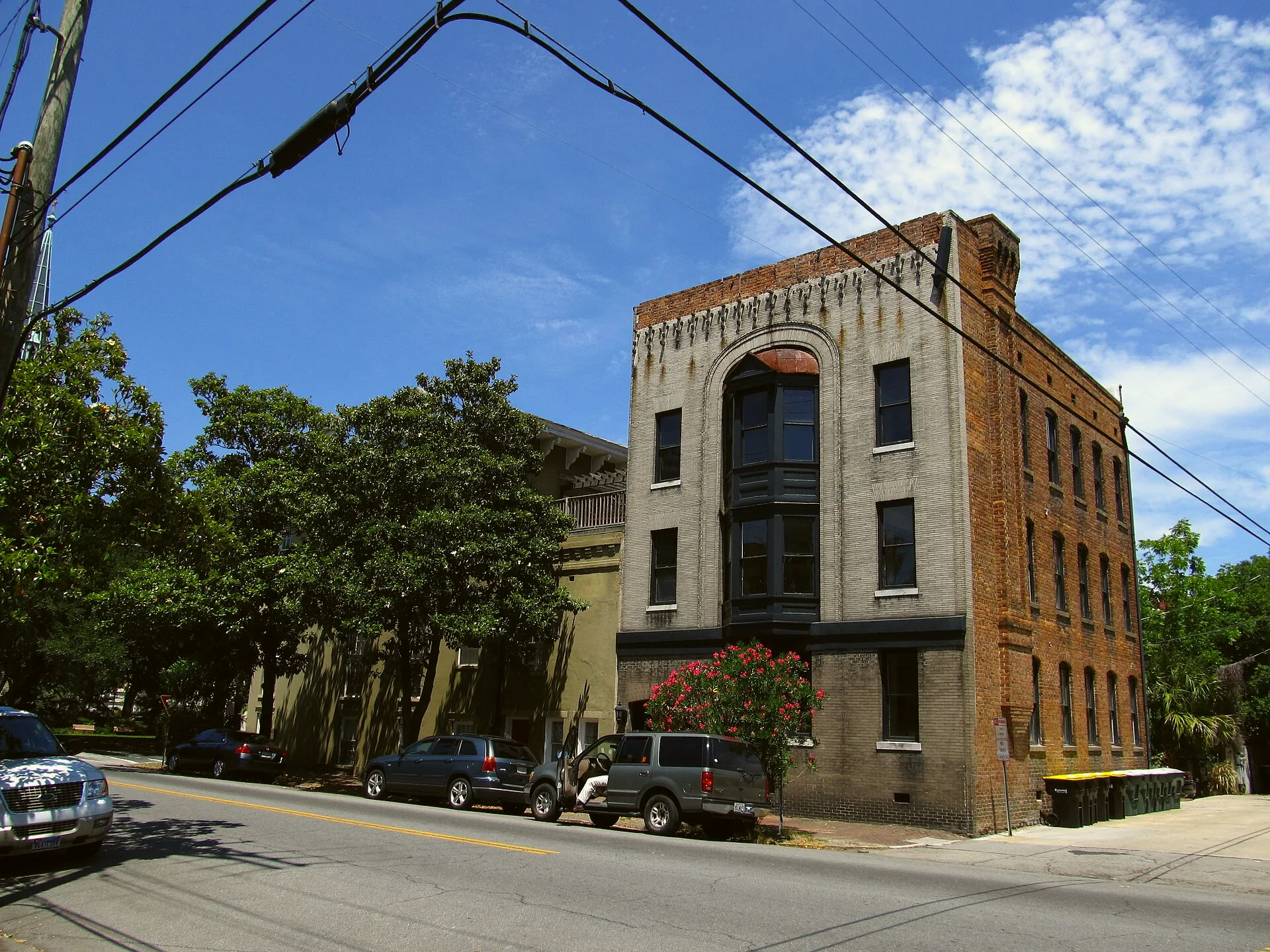 Abercorn Street crossing Charlton Street in Savannah, with buildings lining the junction.