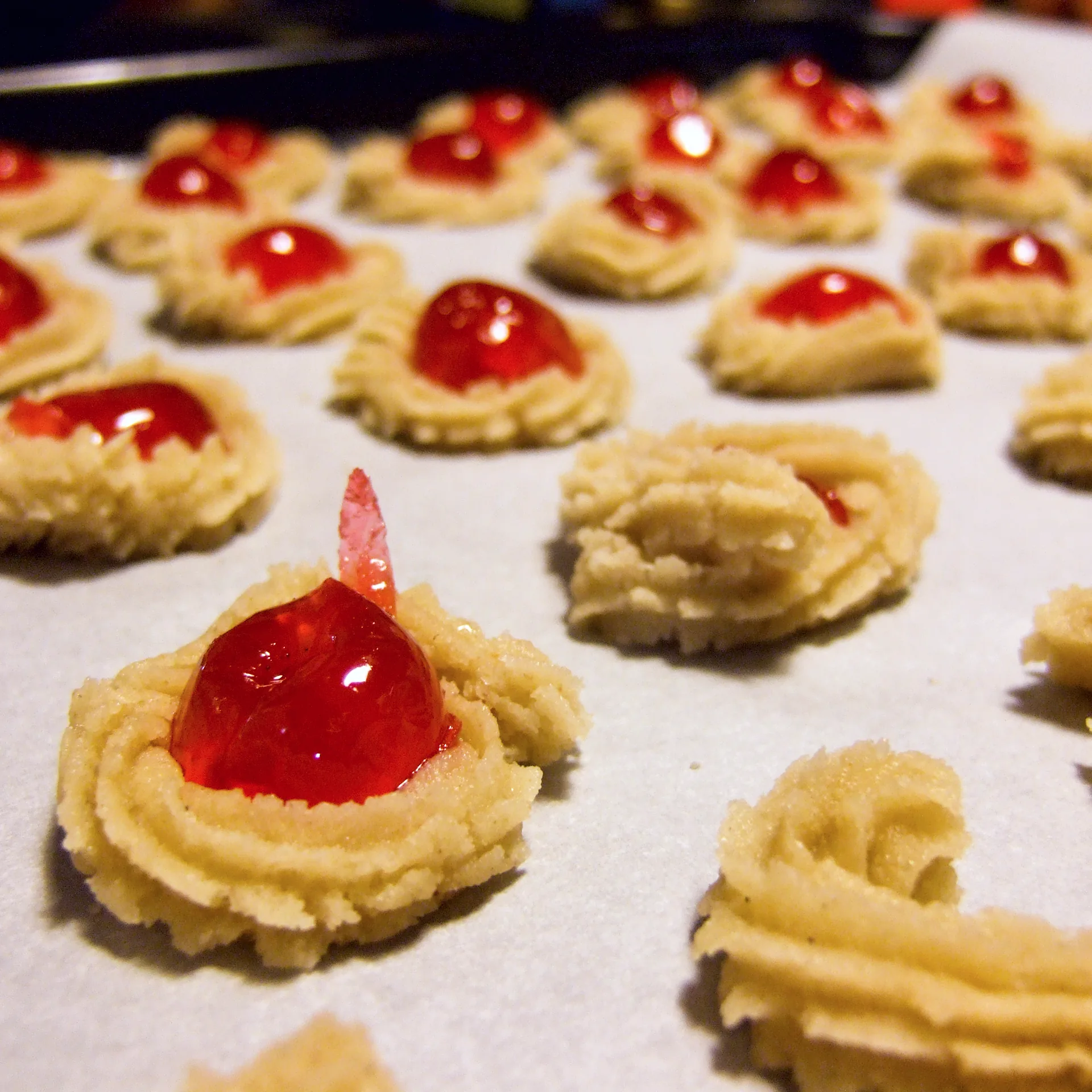 A selection of decorated bredele biscuits arranged on a copper tray.