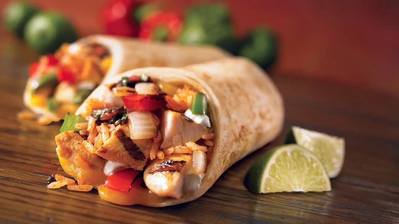 A burrito on a plate.