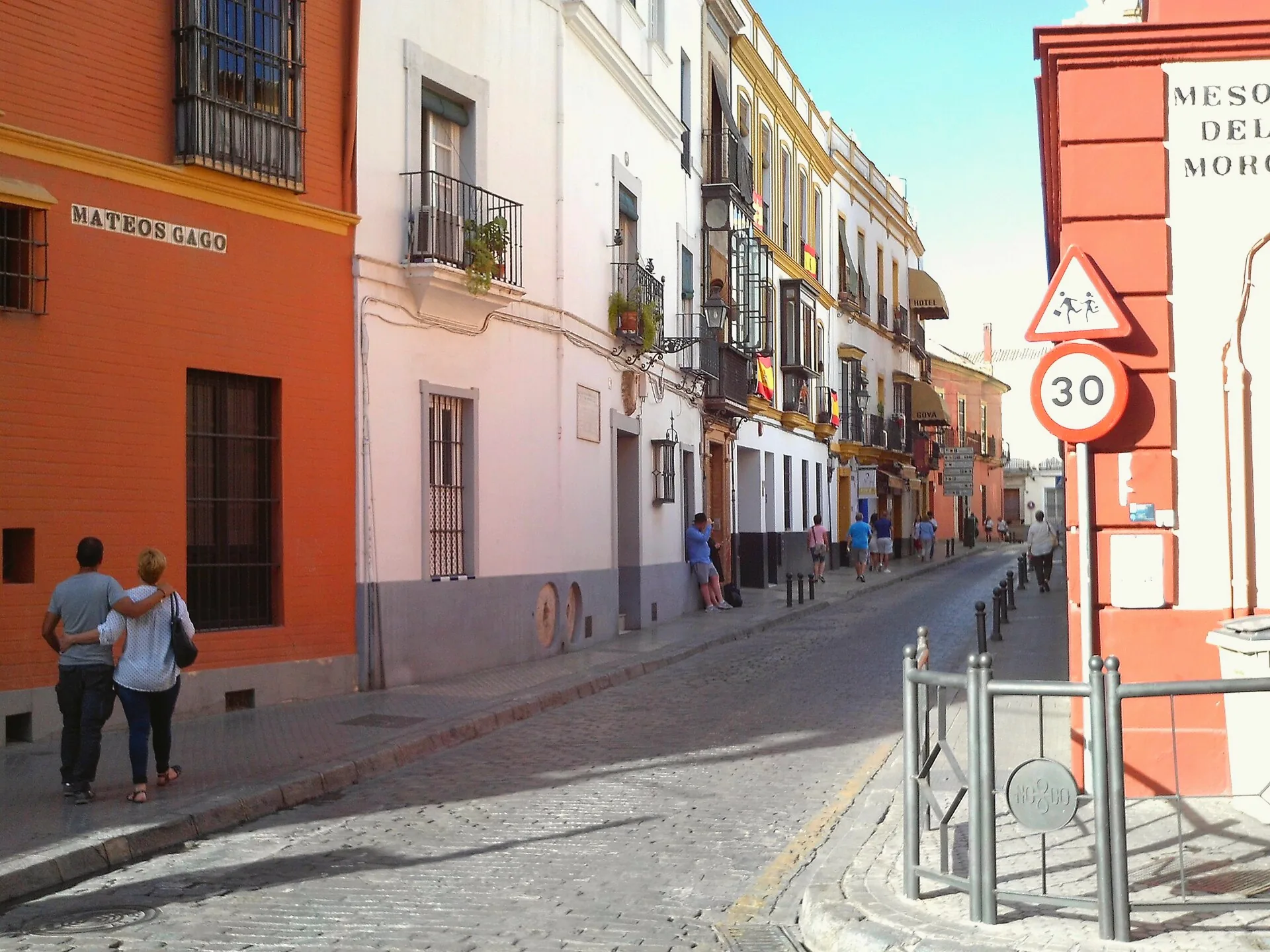 Calle Mateos Gago in Seville, with buildings lining the street.