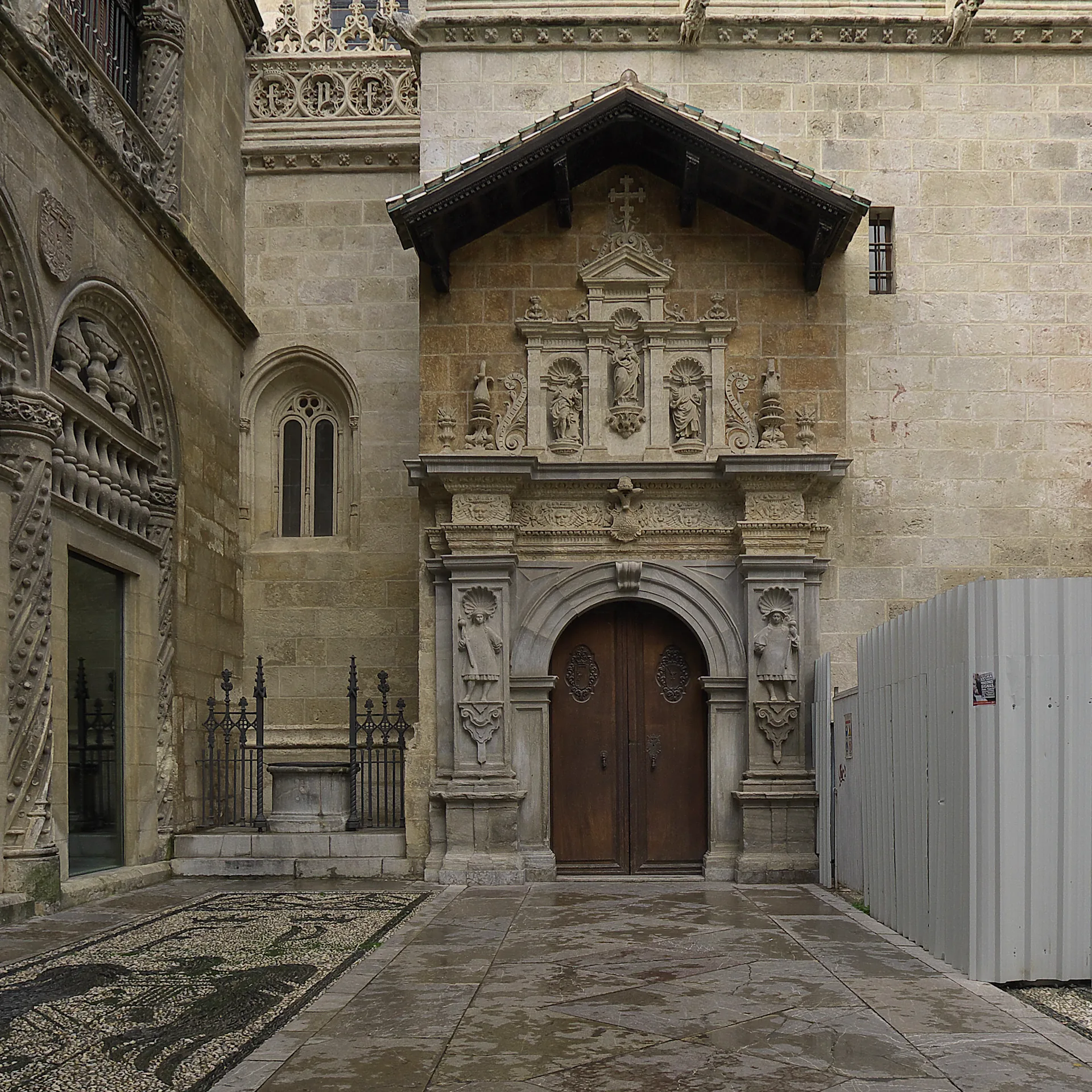 The north portal of the Royal Chapel of Granada, with carved stonework around the entrance.