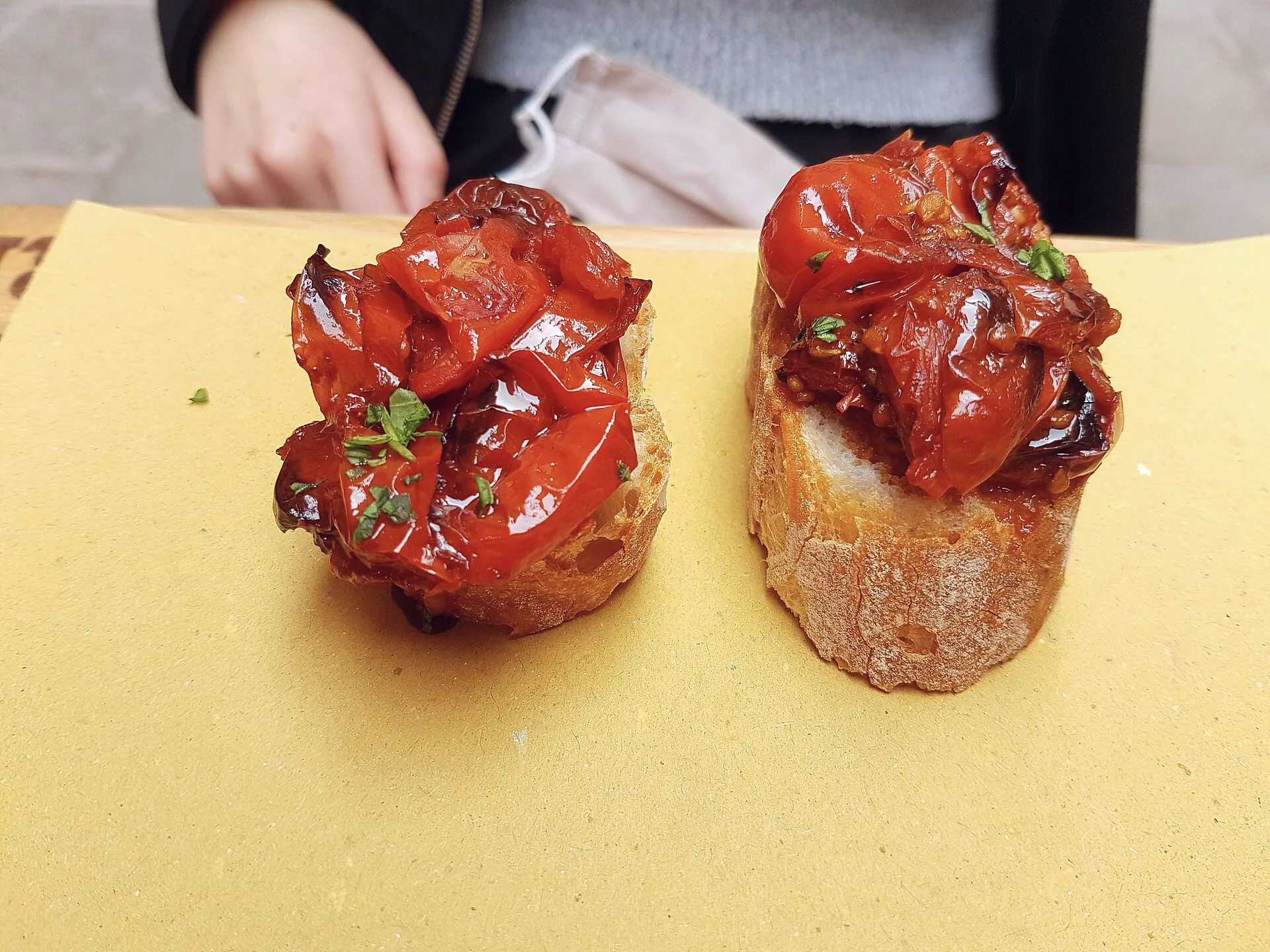 Two small cicchetti topped with dried tomatoes