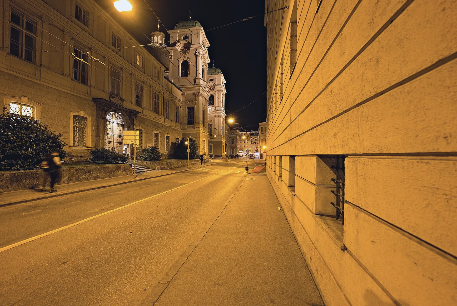 Dreifaltigkeitsgasse at night, with buildings along the street.