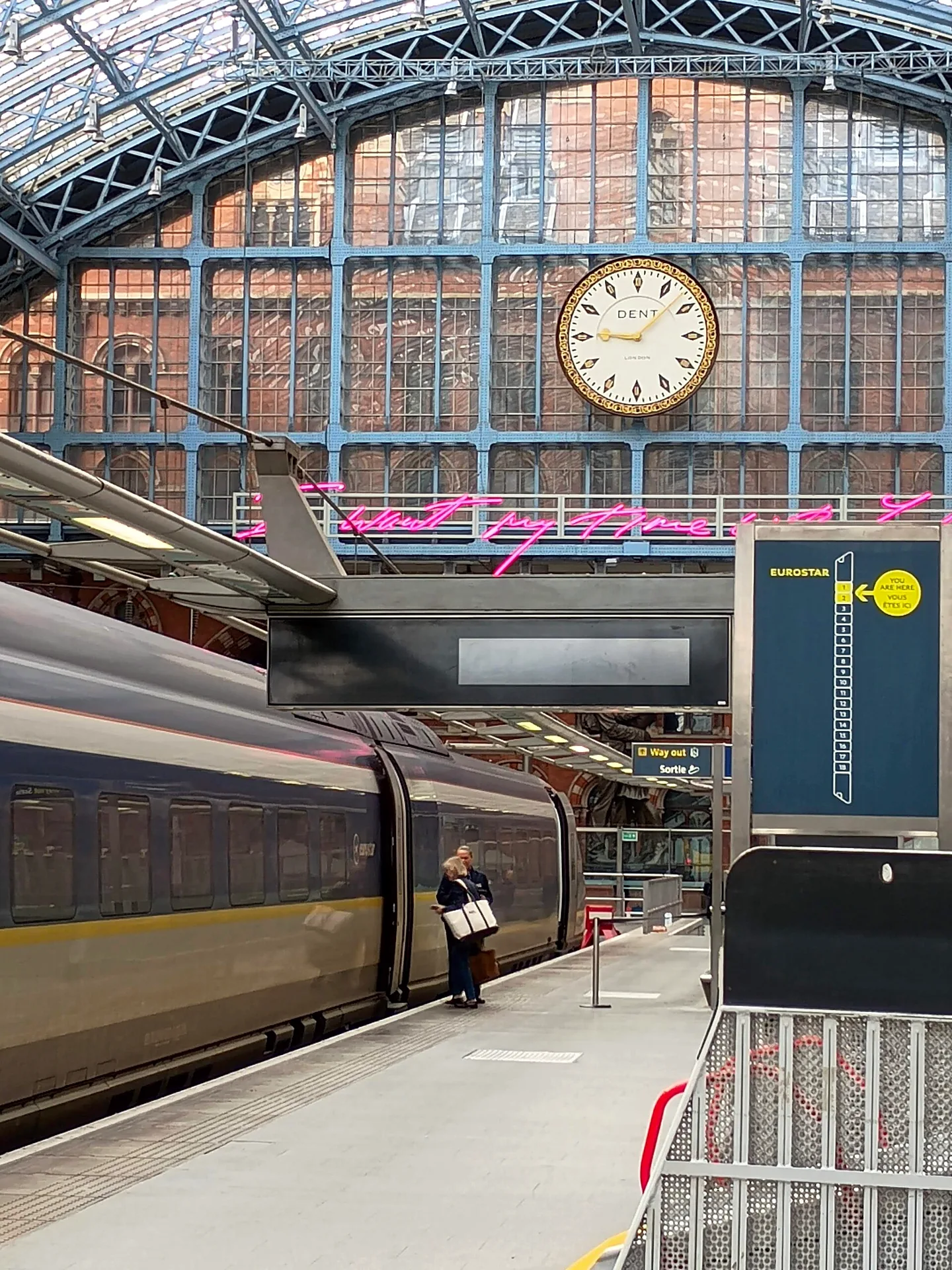 Eurostar platform at St Pancras International station, with tracks and platform visible beneath the station roof.