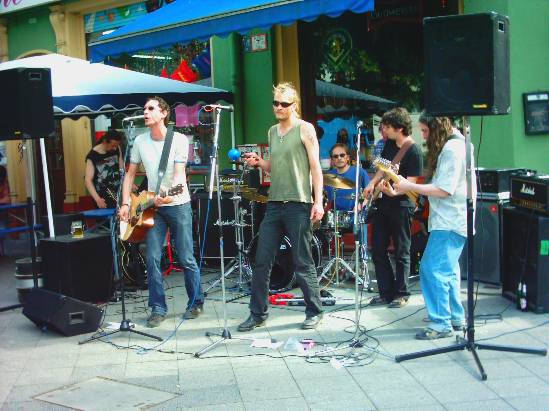 A punk band performs on an outdoor stage at Fête de la Musique in Kreuzberg, Berlin.