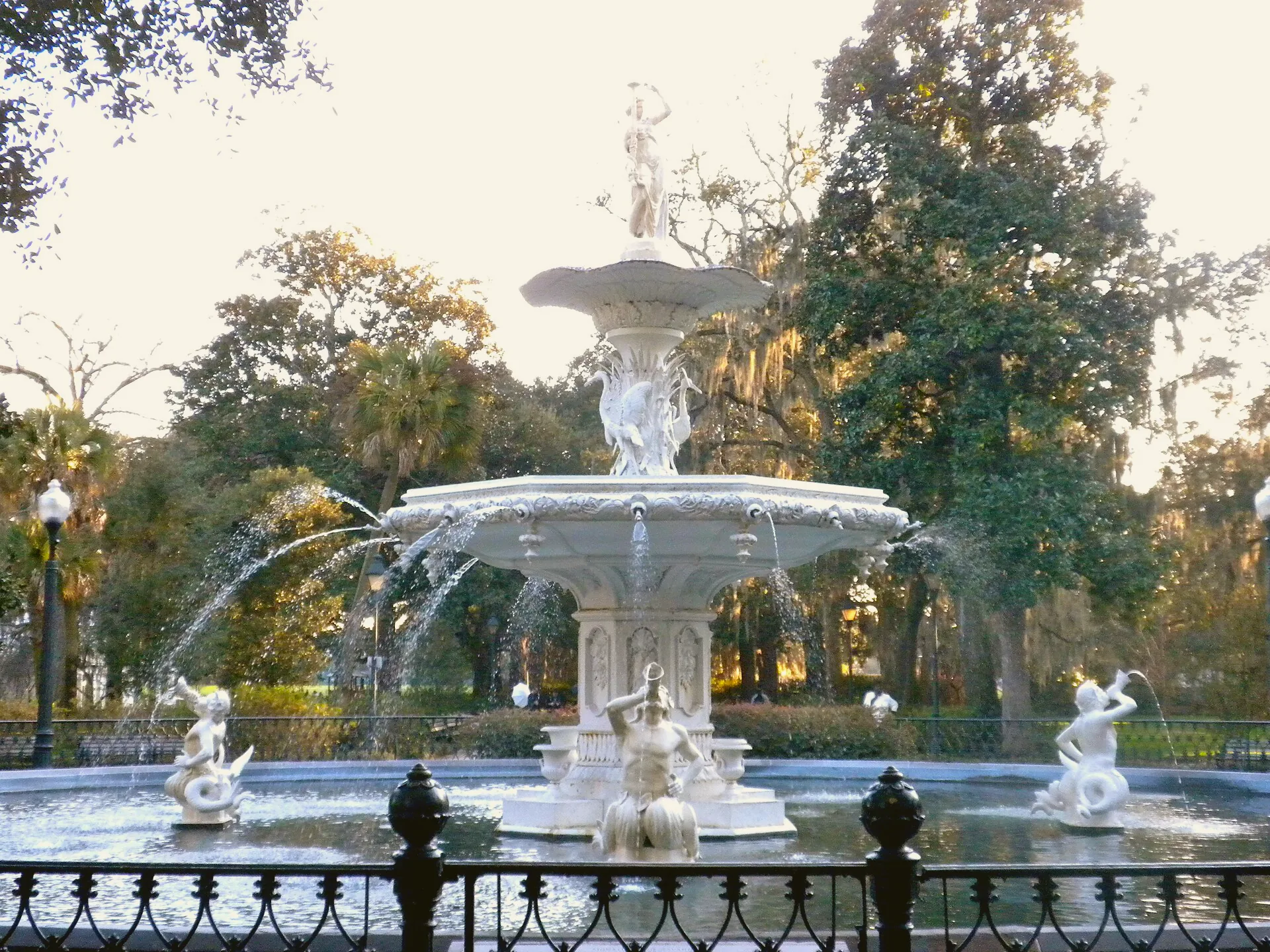 The ornate, tiered Forsyth Park Fountain rises above its surrounding pool.