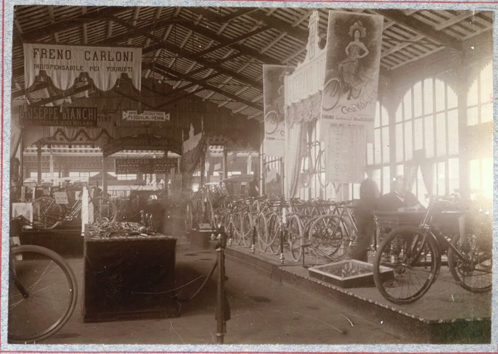 Bicycles displayed inside the 1898 Italian General Exhibition gallery in Turin.