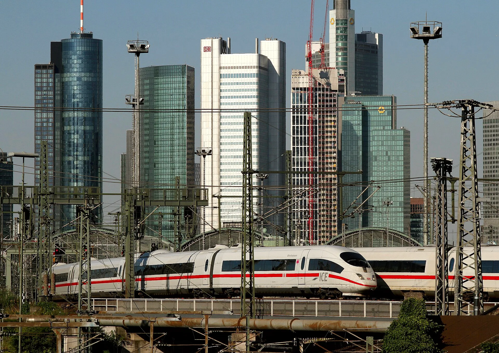 Two ICE trains stand at platforms inside Frankfurt (Main) Hauptbahnhof.