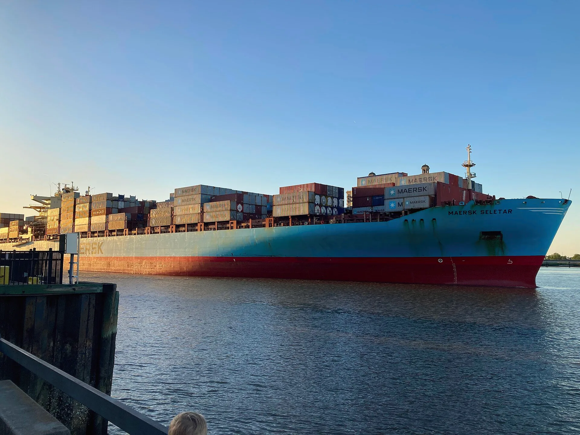 A container ship travelling along the Savannah River in Savannah, Georgia.