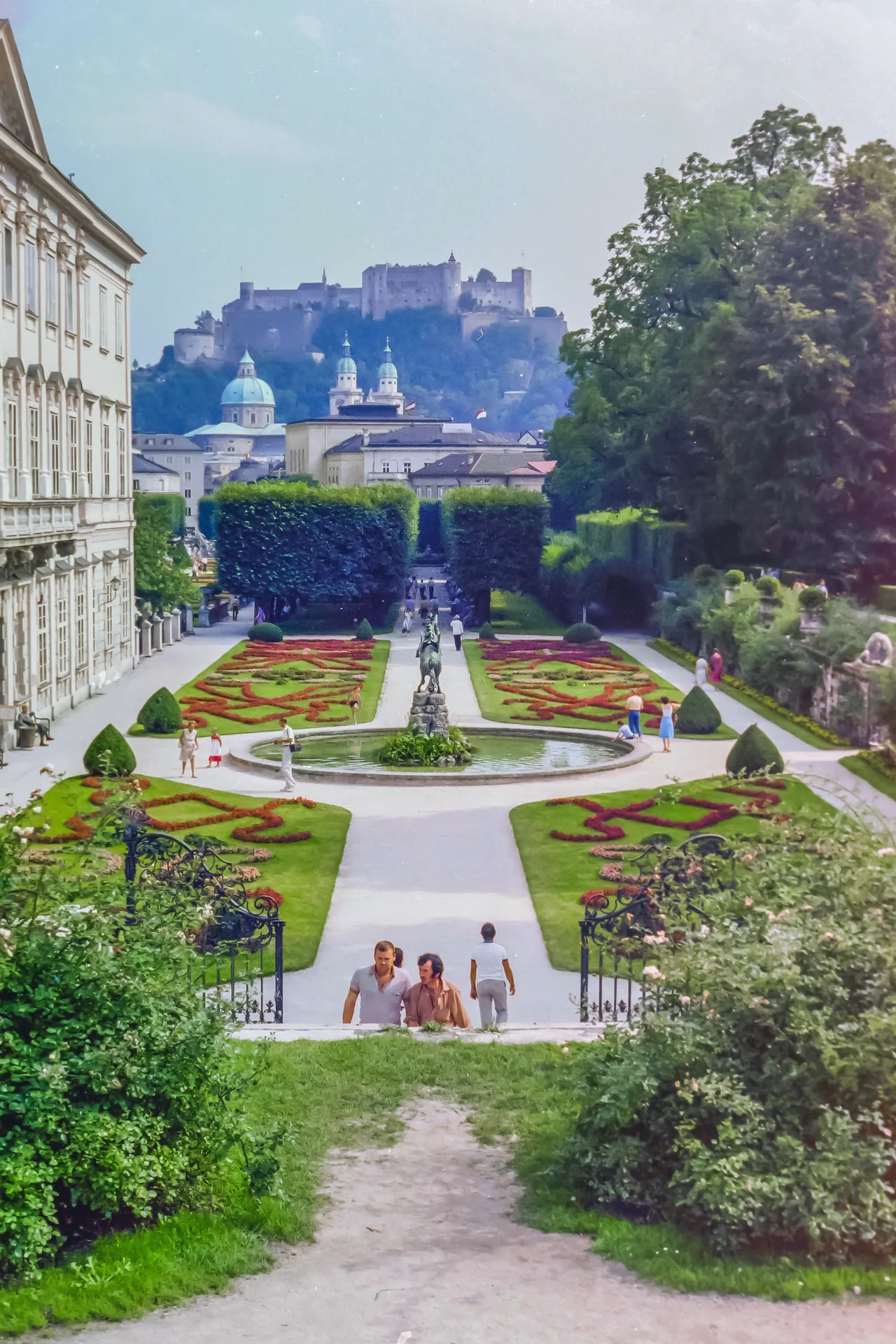 A view through Mirabell Garden towards the fortress, with the Pegasus Fountain in the centre.