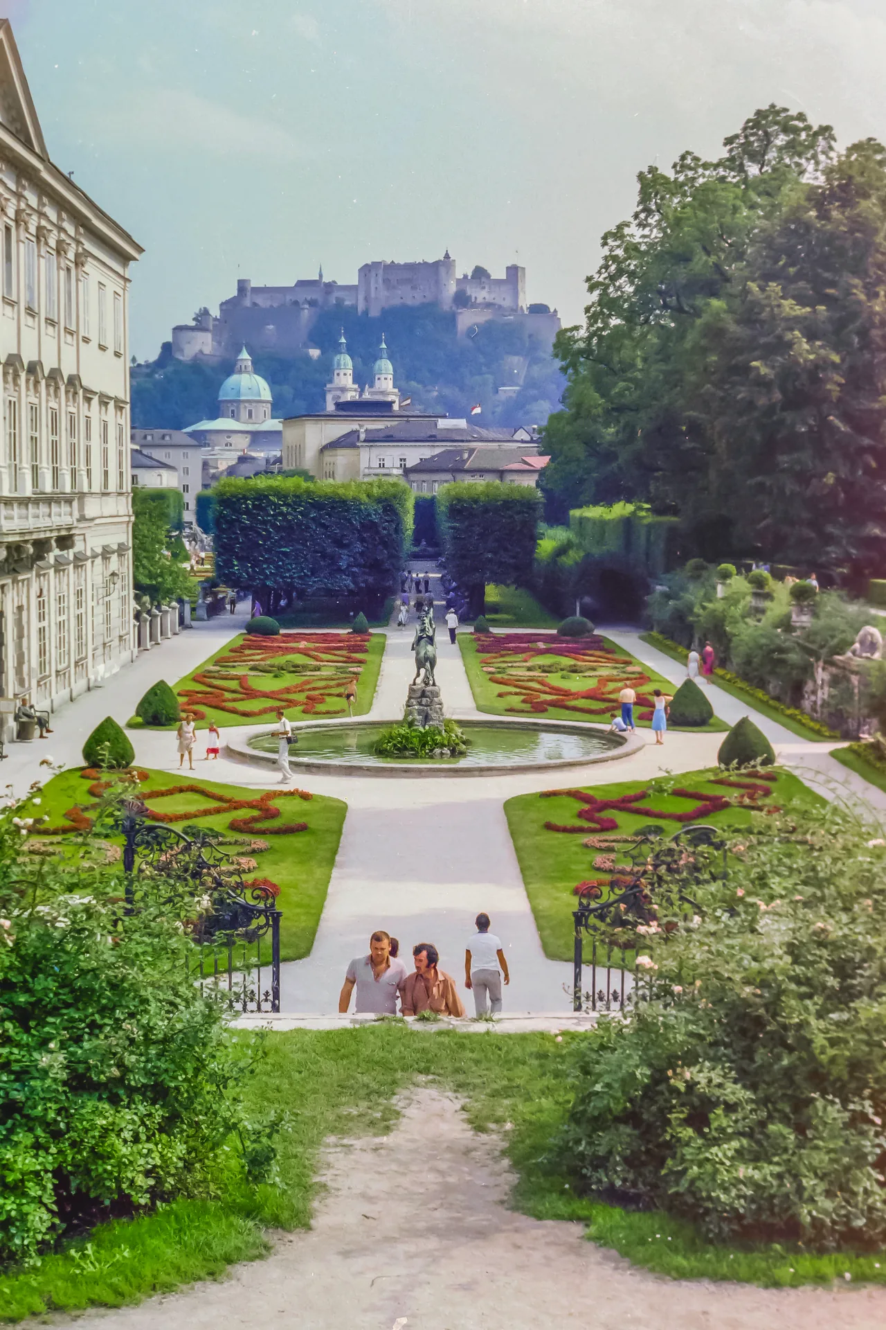 A view through Mirabell Gardens towards Hohensalzburg Fortress, with the Pegasus Fountain in the centre.