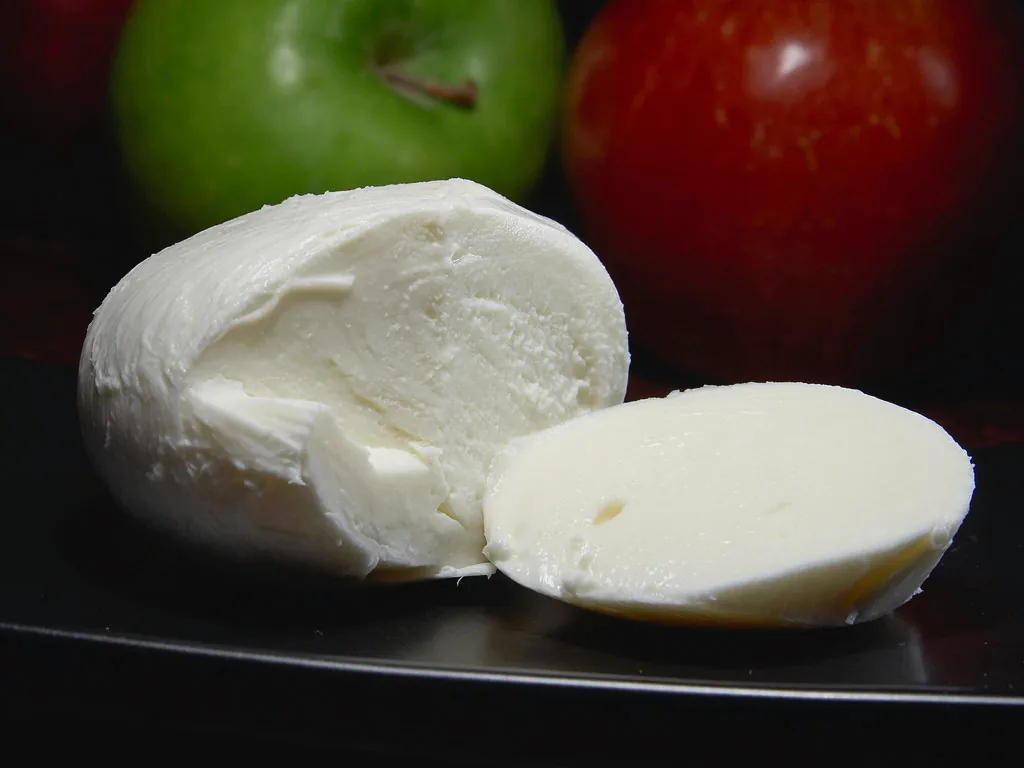 Mozzarella cheese on a plain background.