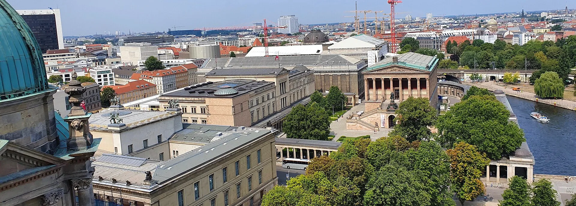 Museumsinsel on the River Spree, with historic museum buildings along the waterfront.