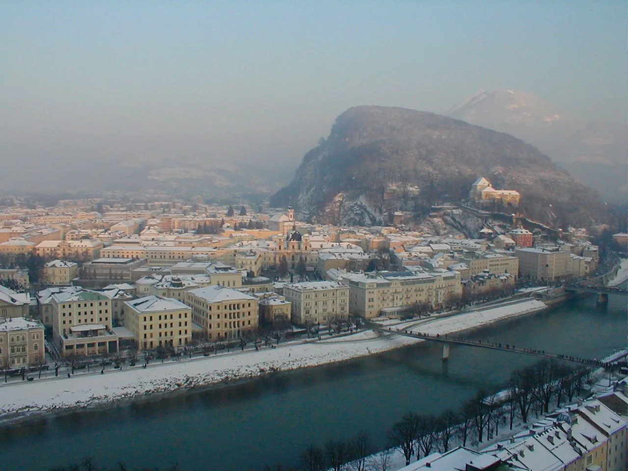 Salzburg’s Neustadt in winter, with snow-covered streets and buildings.