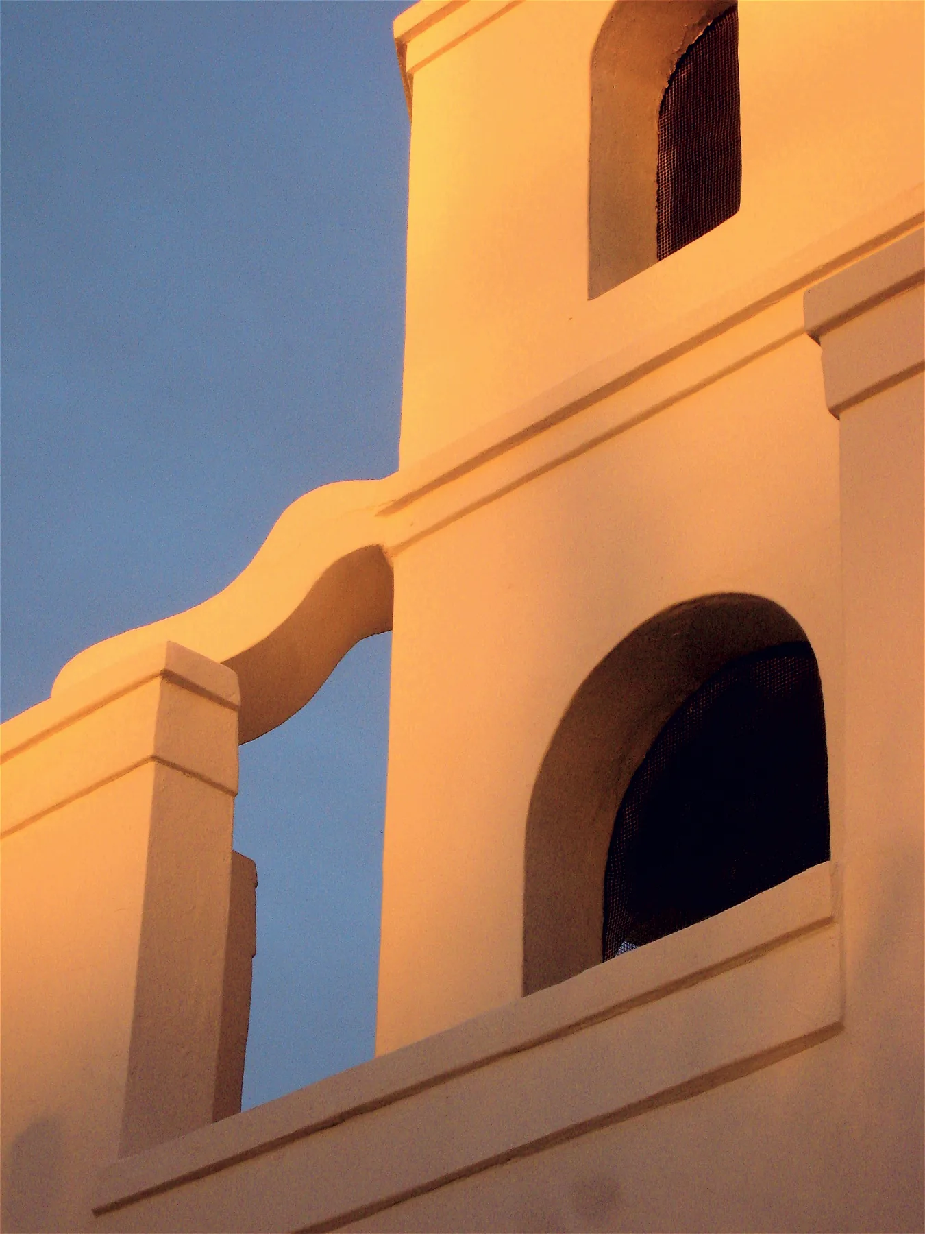 Old Adobe Mission in Scottsdale, with its adobe church exterior in the evening light.
