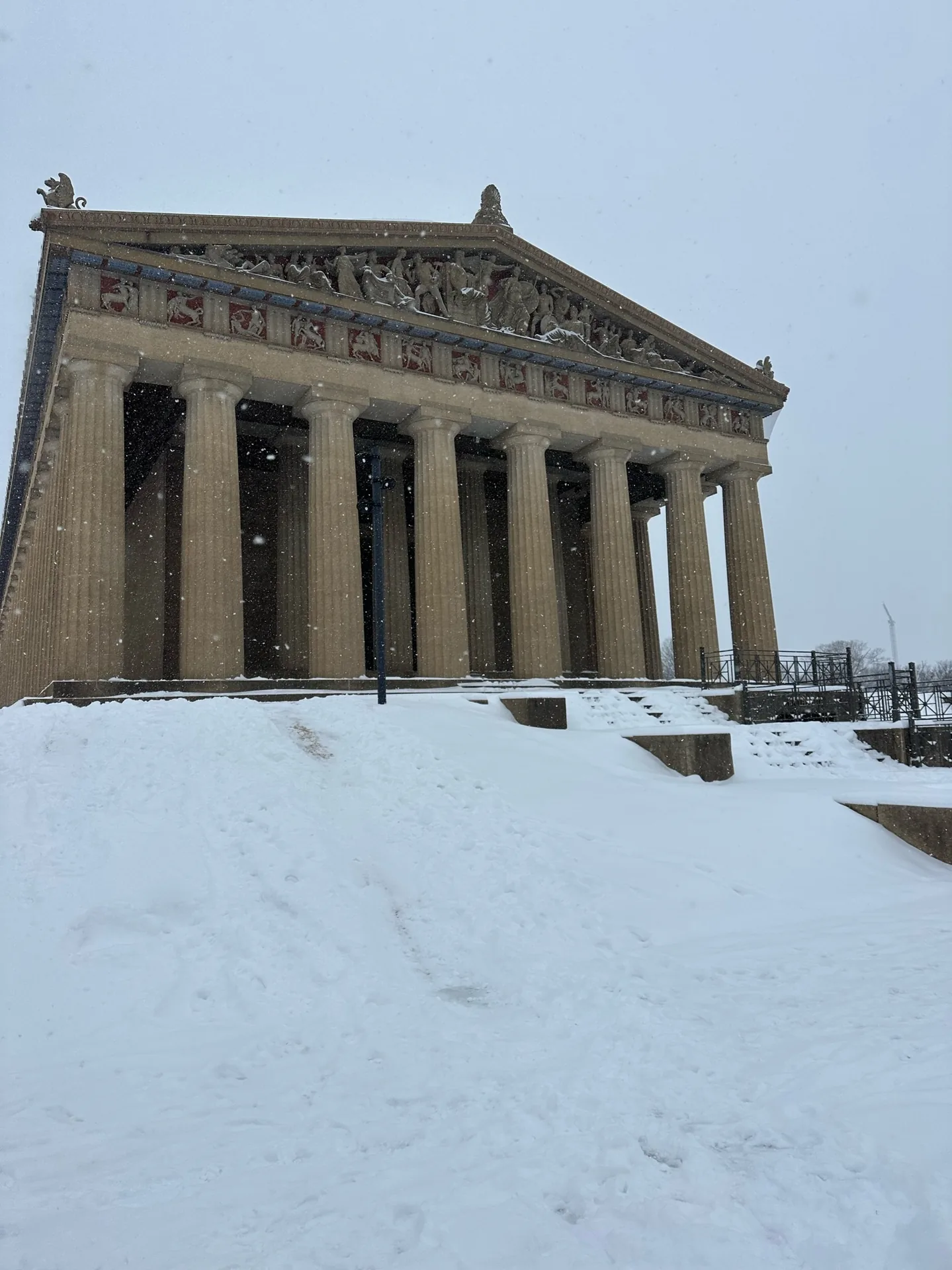 The Nashville Parthenon and its grounds covered in snow.