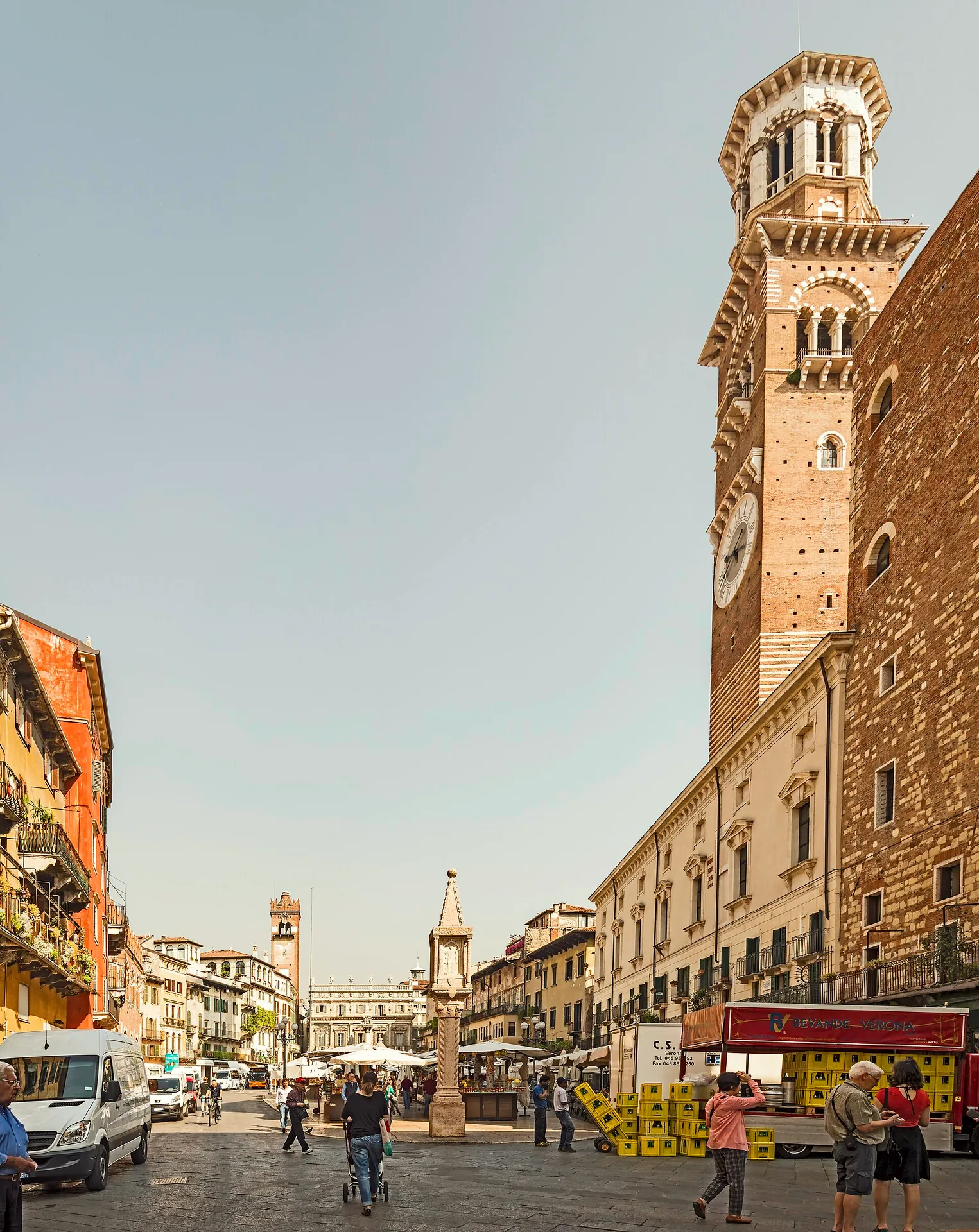 A broad view across Piazza delle Erbe towards Torre dei Lamberti in Verona.