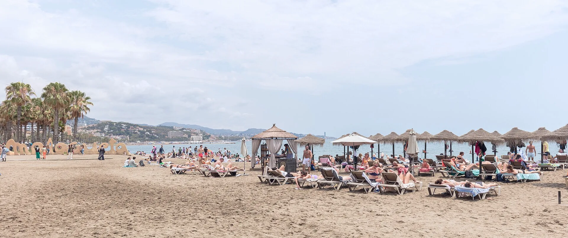 The shoreline and beach at Playa de la Malagueta in Málaga.
