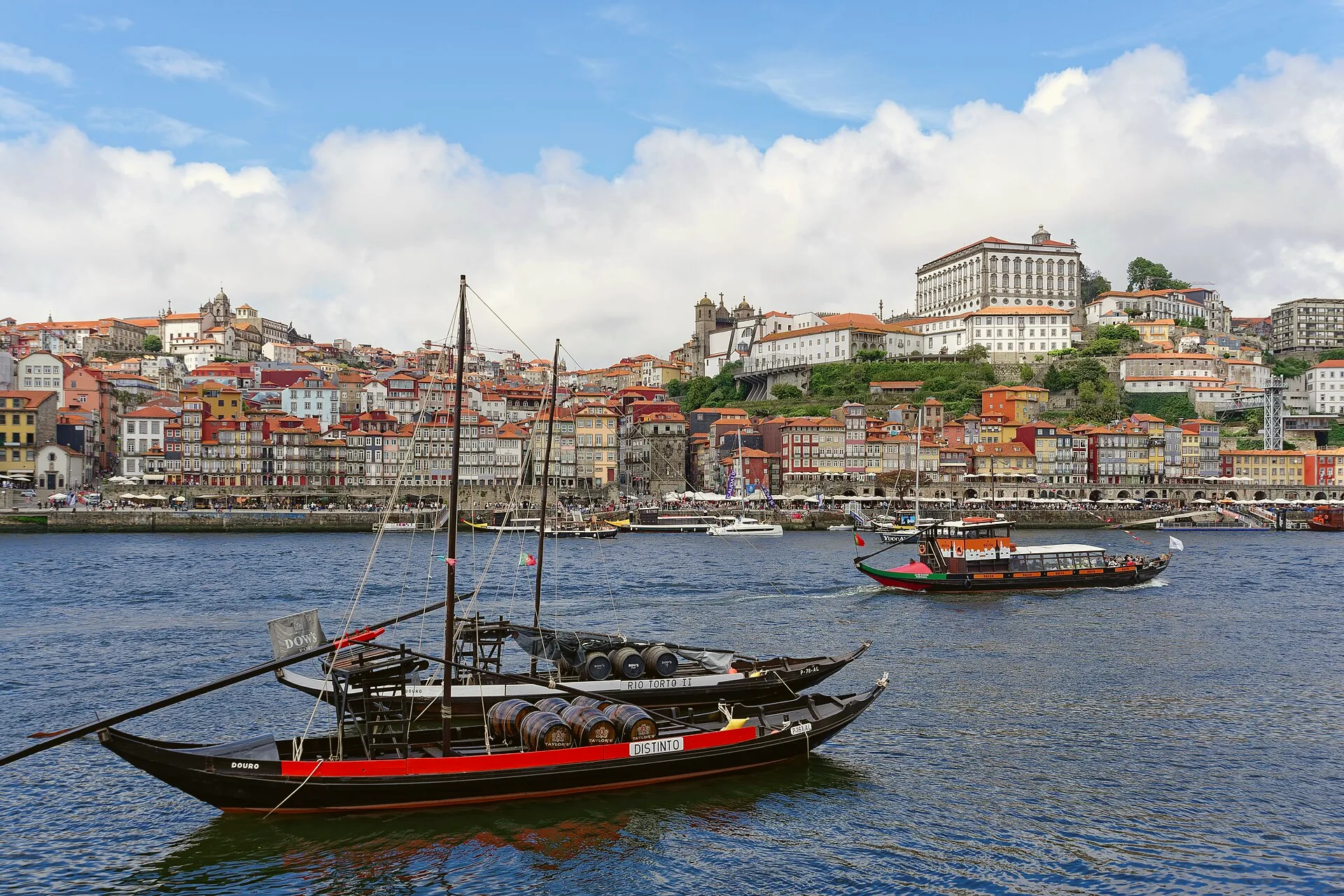 Rabelo boats on the Douro, with Porto Cathedral behind the Ribeira district.