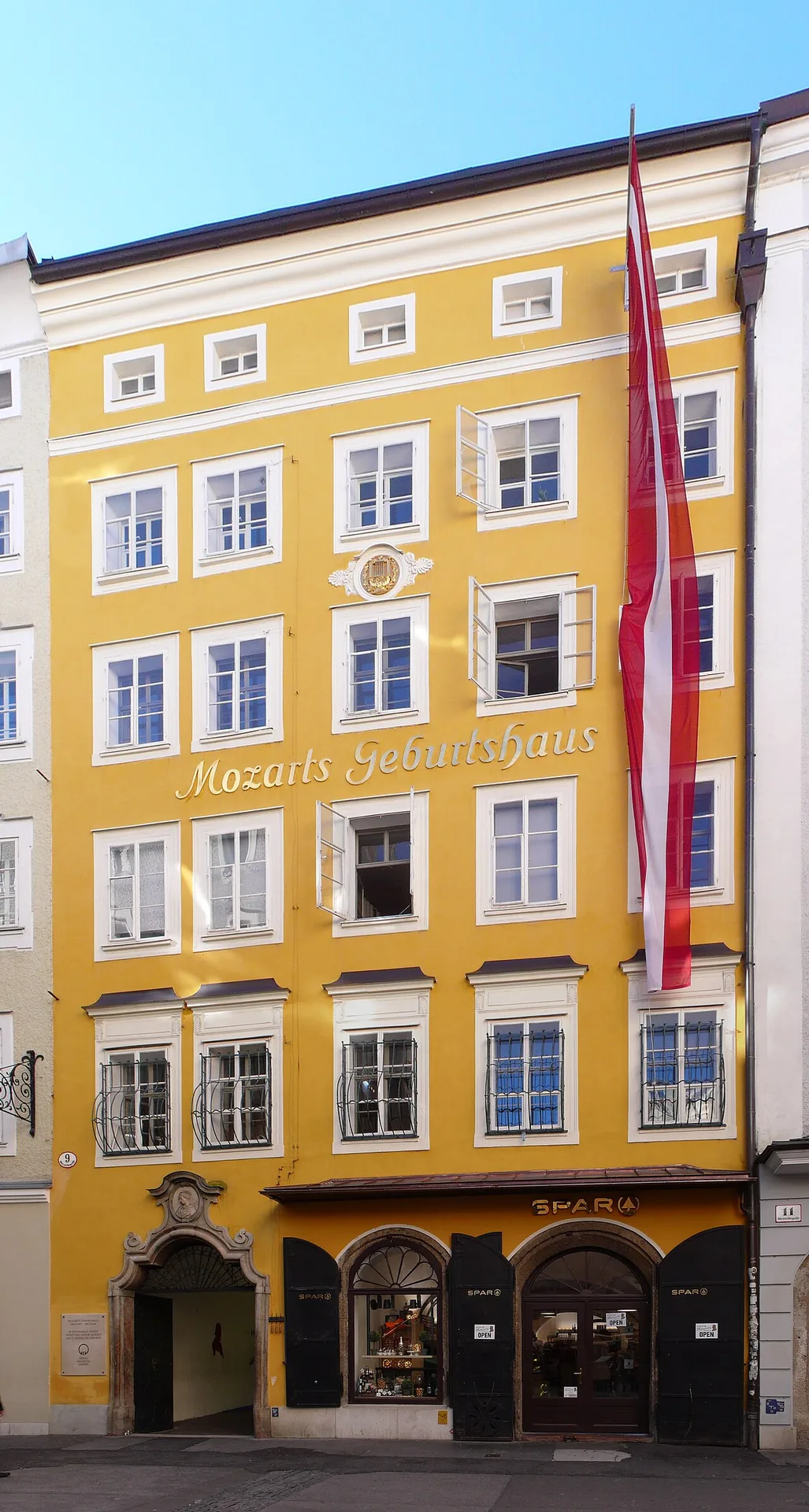 The narrow façade of Mozart’s birthplace at Getreidegasse 9 in Salzburg.