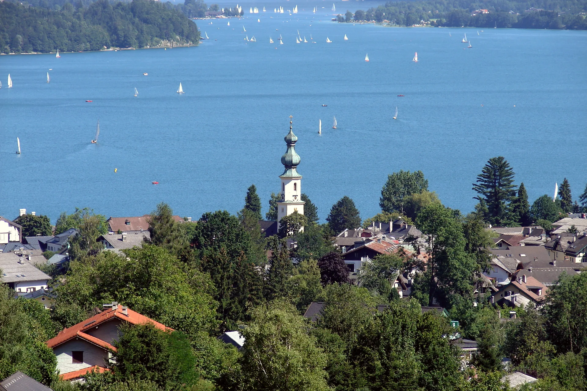 Sankt Gilgen beside the Wolfgangsee, with the town and lake framed by surrounding mountains.