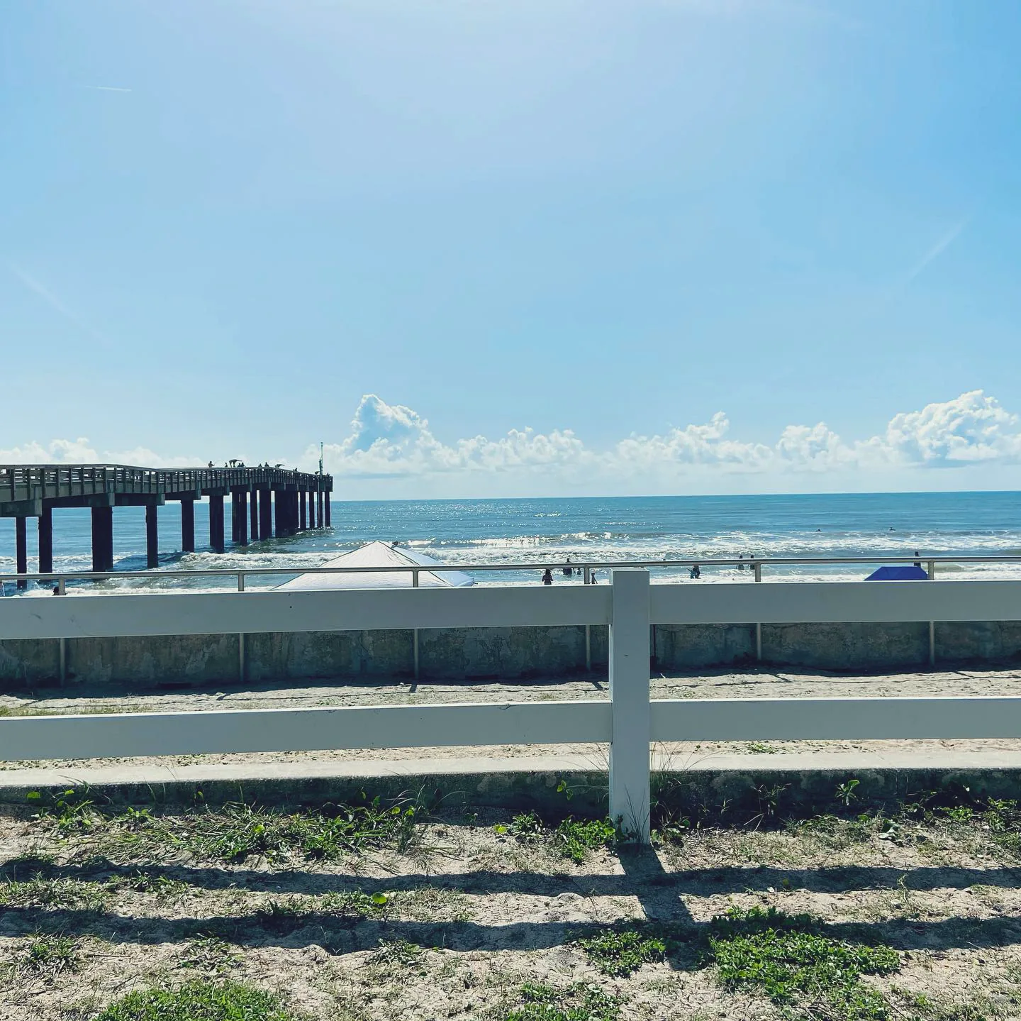 St Johns County Ocean and Fishing Pier extending over the Atlantic at St Augustine Beach.