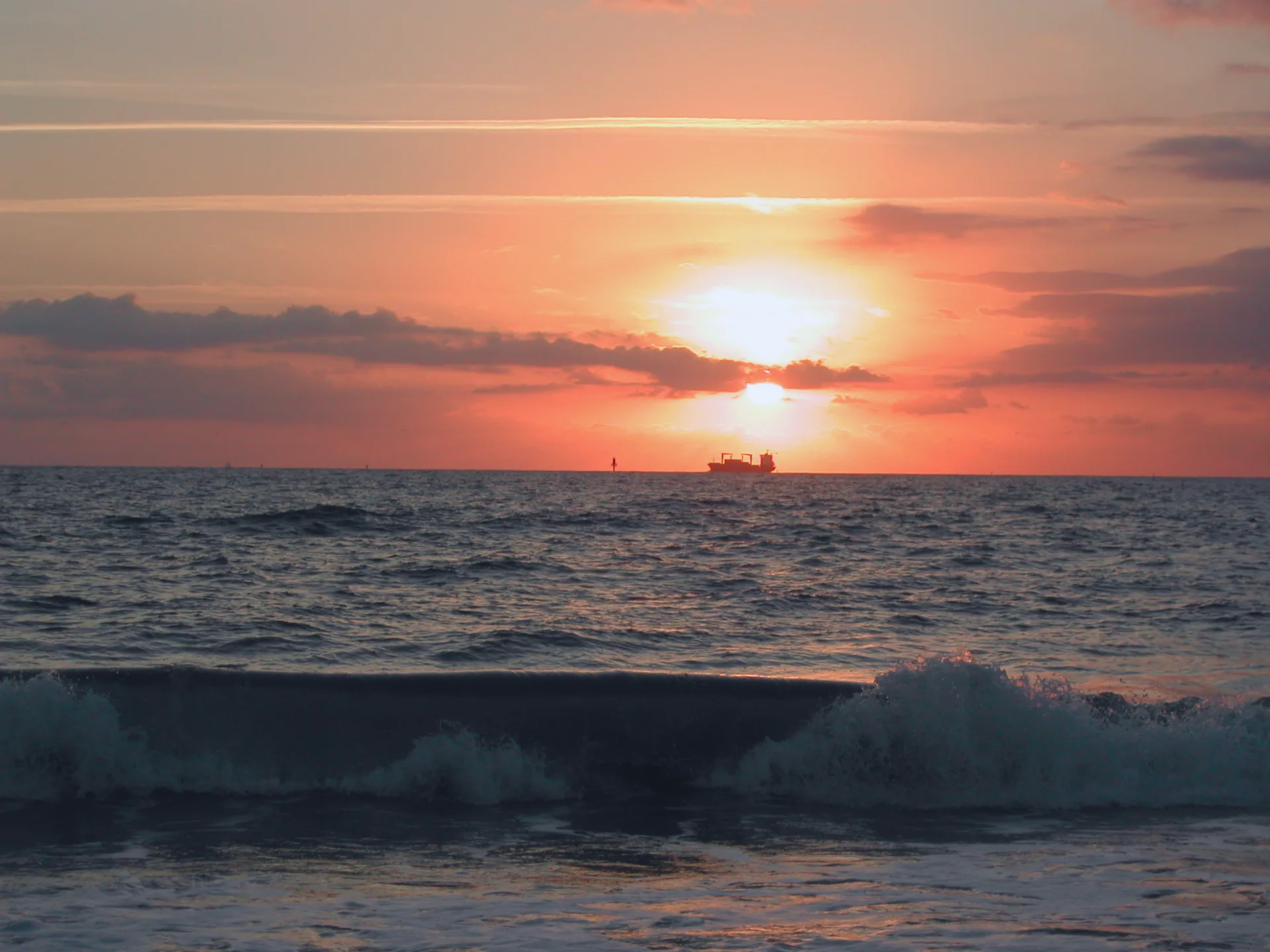 Sunrise over the sandy north beach on Tybee Island, with the ocean beyond.