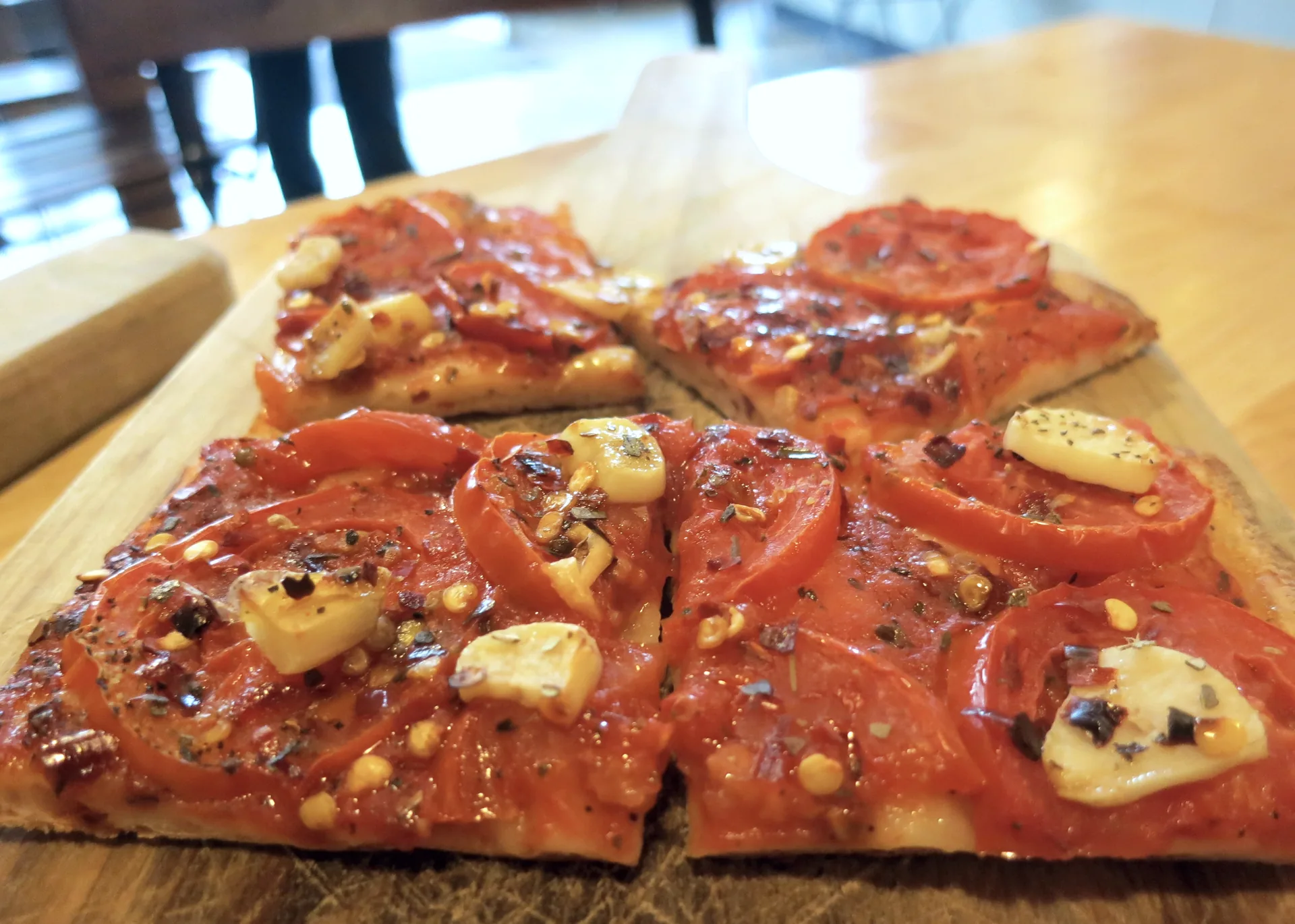 Tomato and garlic flatbread pizza.