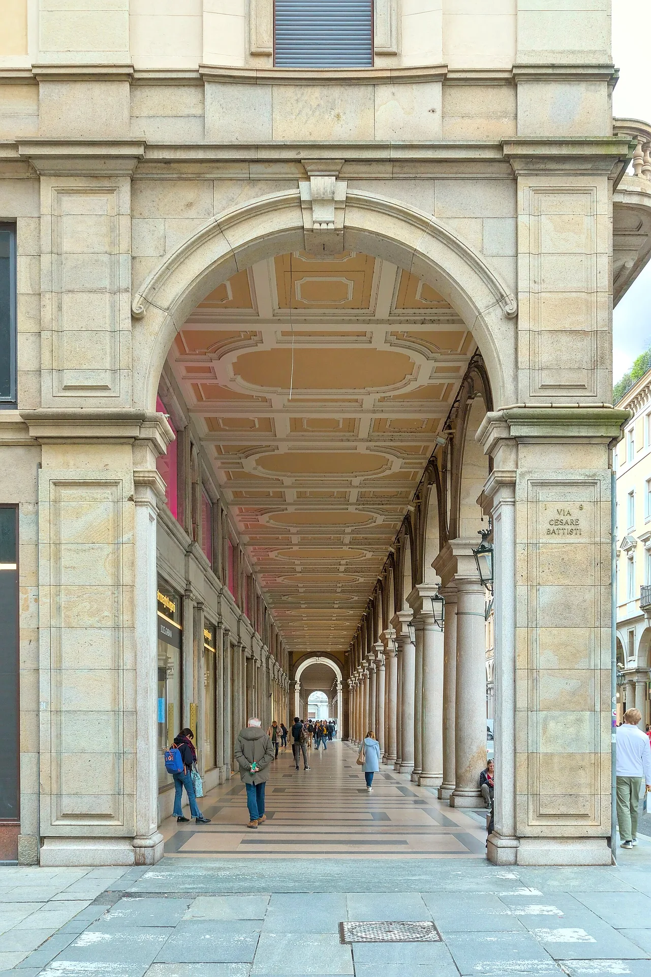 The arcades along Via Roma in Turin, with the street extending into the distance.