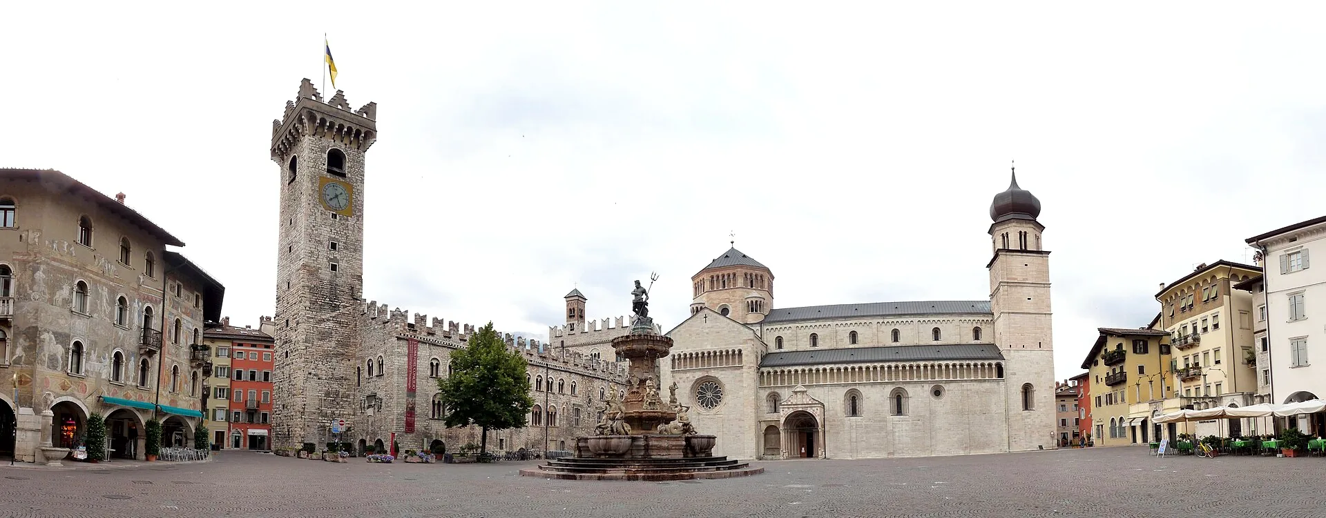 Panoramic view of Piazza del Duomo in Trento, with the Neptune fountain, Civic Tower and Cathedral of Saint Vigilius around the square.