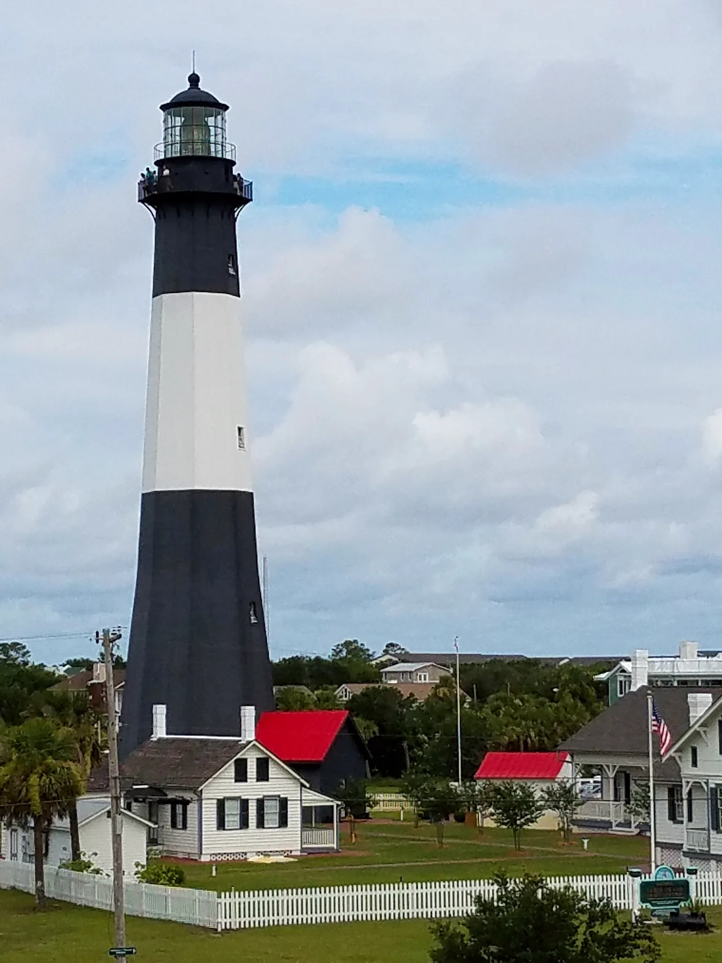 Tybee Island Light Station lighthouse beside its keeper cottages.