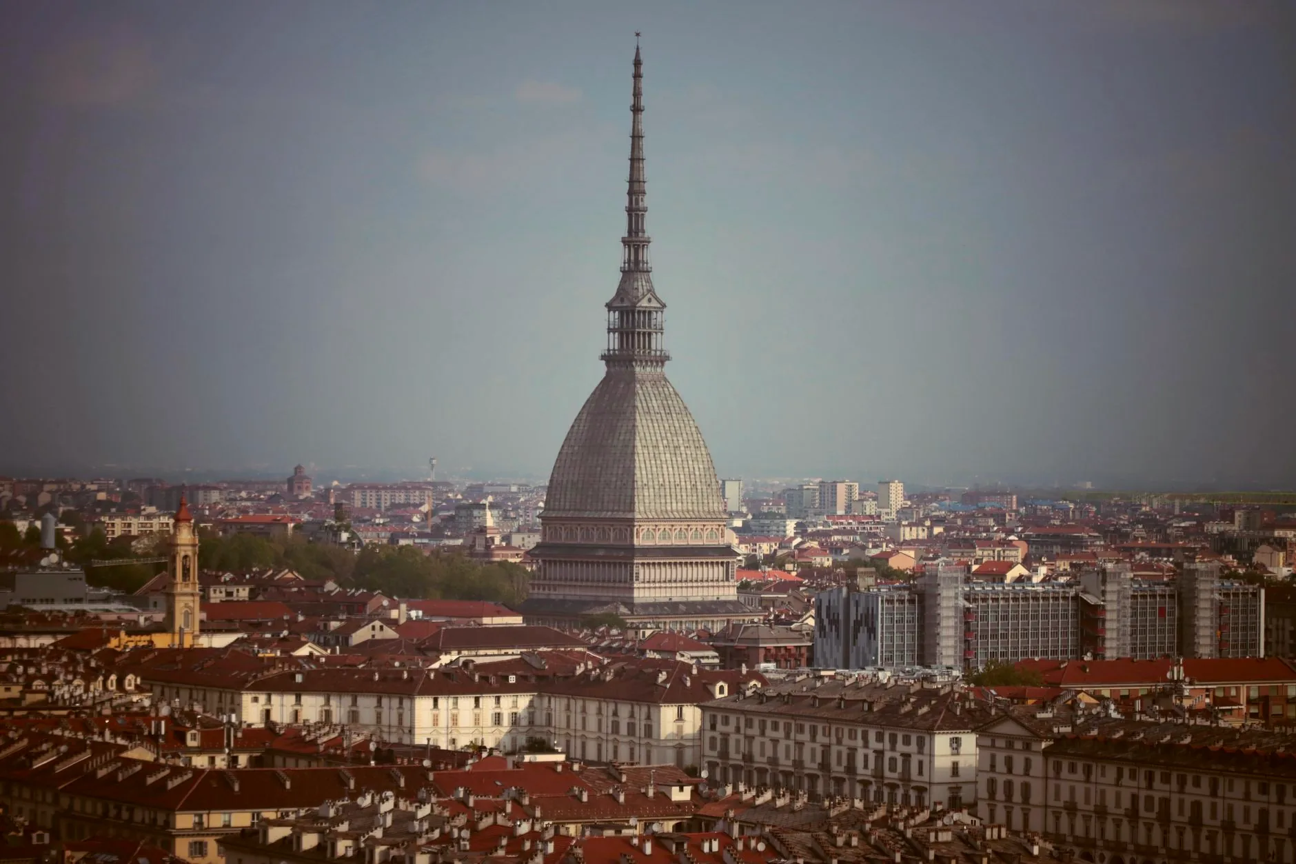 Turin’s skyline with the Mole Antonelliana beneath a clear sky.