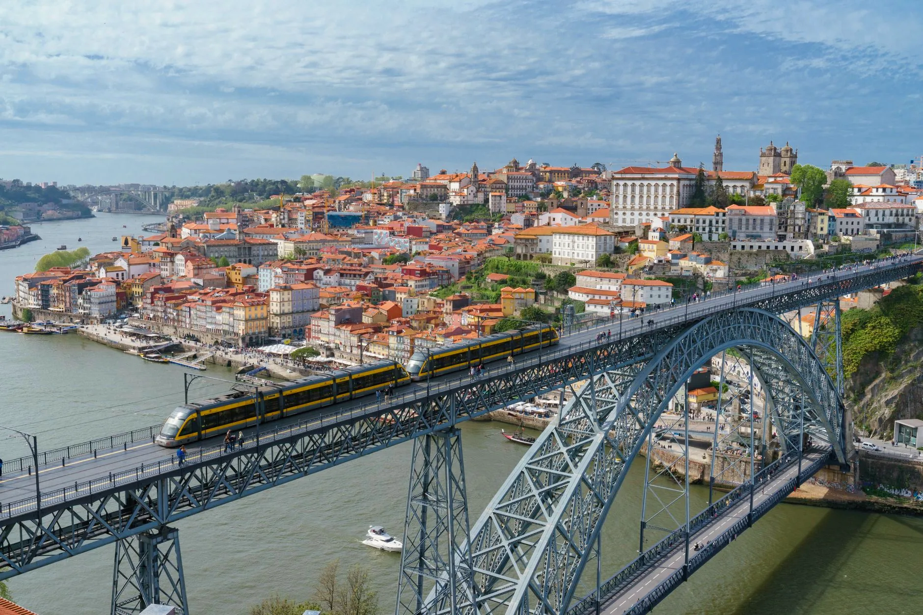 The Luís I Bridge crosses the Douro River between the historic banks of Porto.