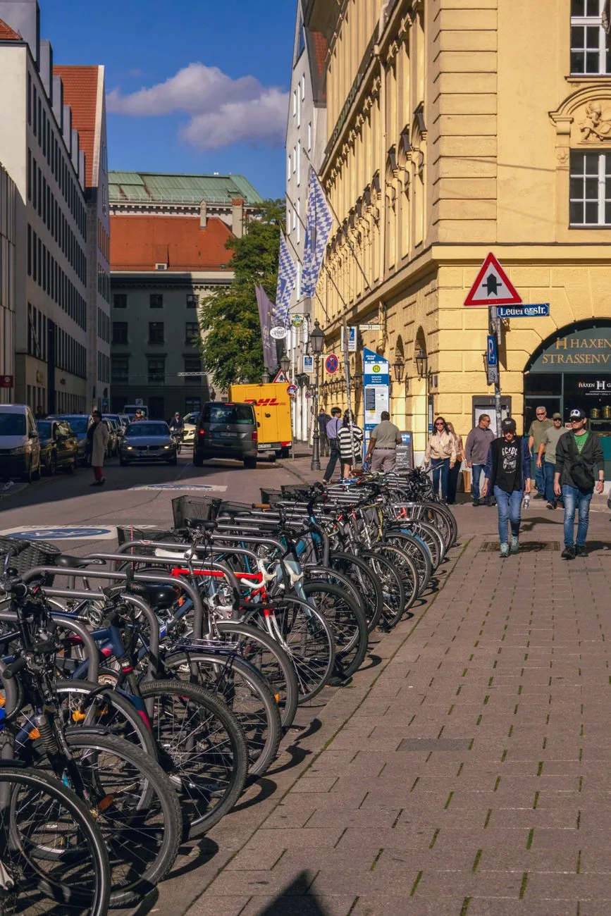 Bicycles lined along a street in Munich.