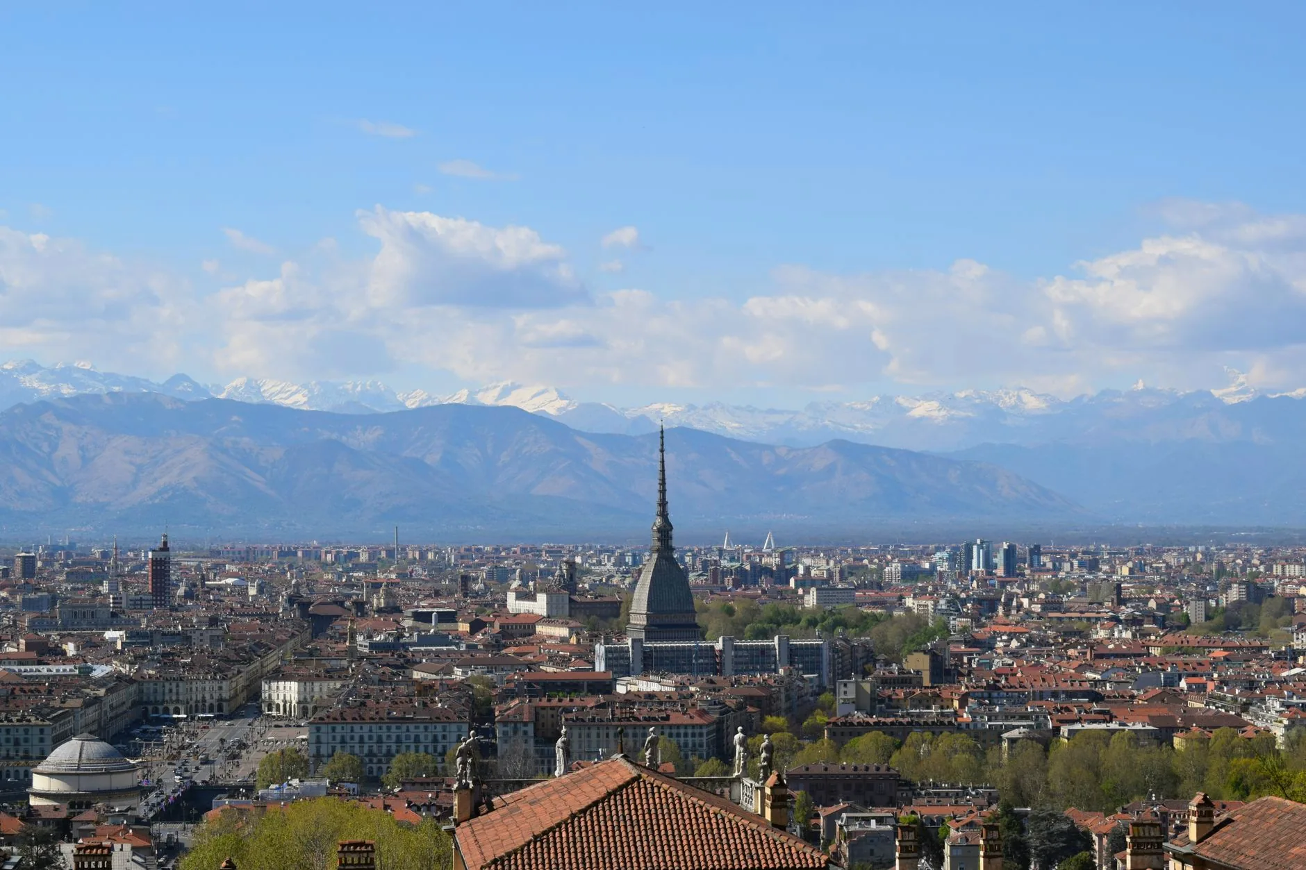 Turin’s rooftops and the Mole Antonelliana, with the Italian Alps in the distance.