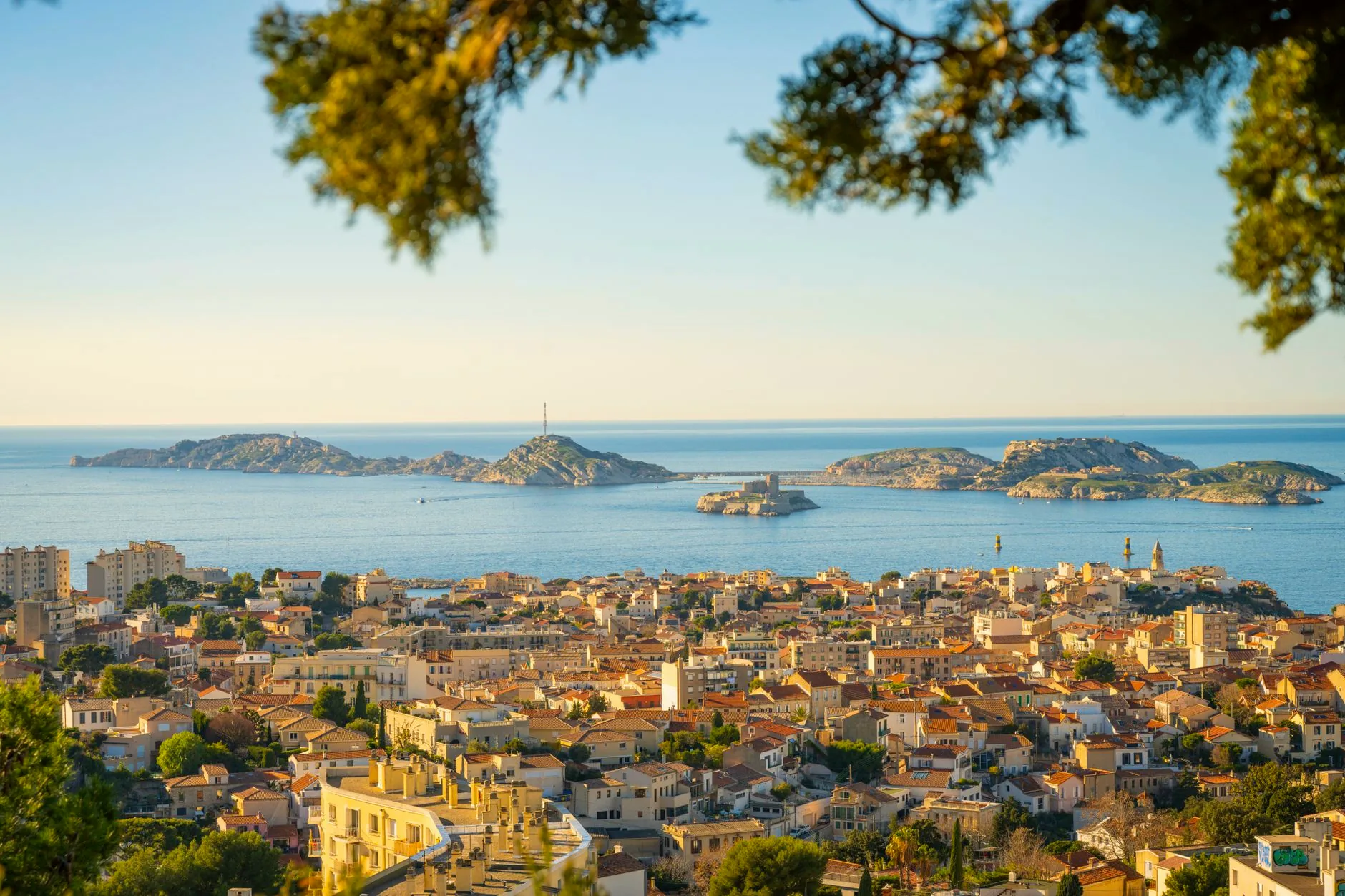Panoramic view across Marseille towards the Mediterranean Sea and nearby islands.