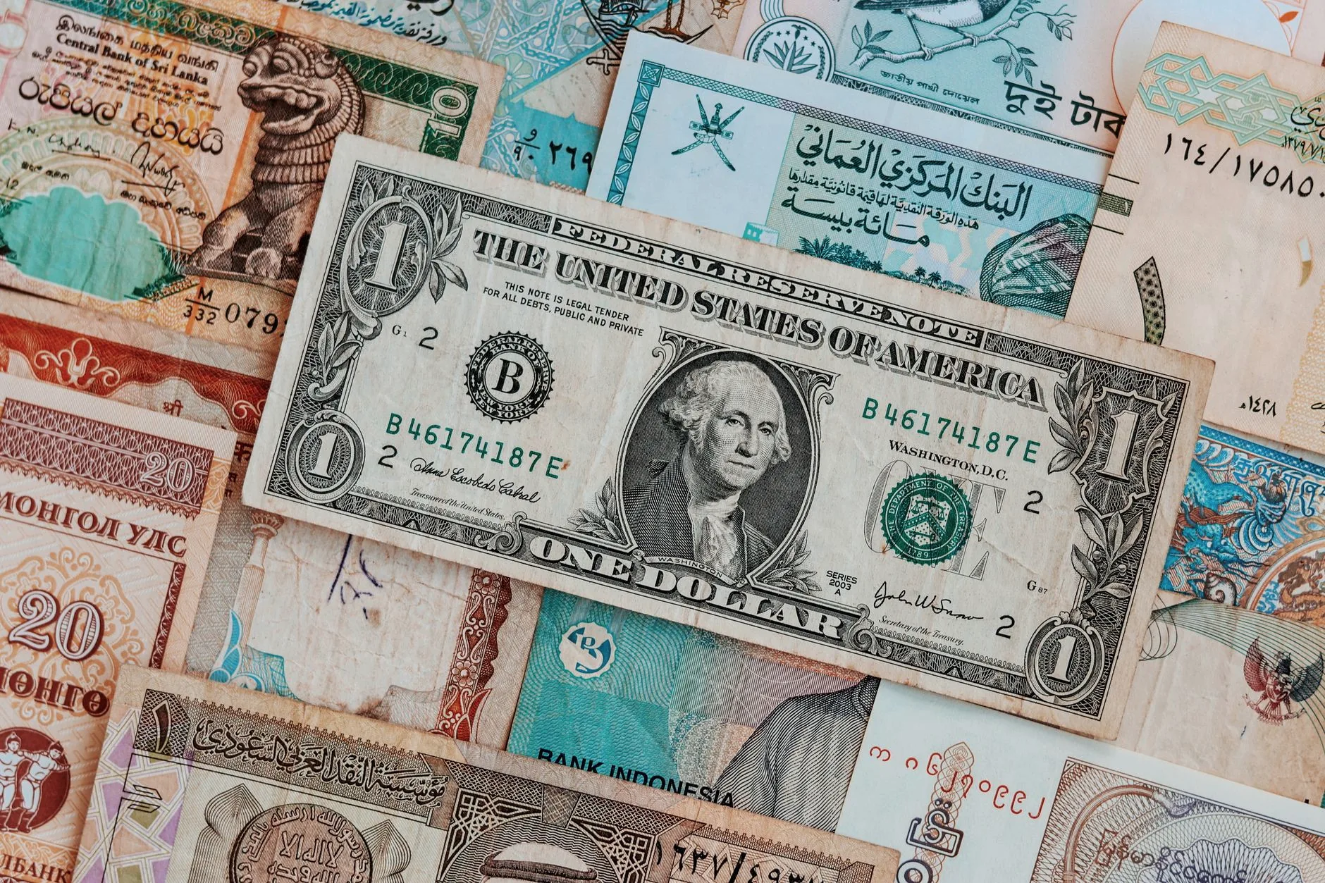 Assorted banknotes, including US dollar bills.